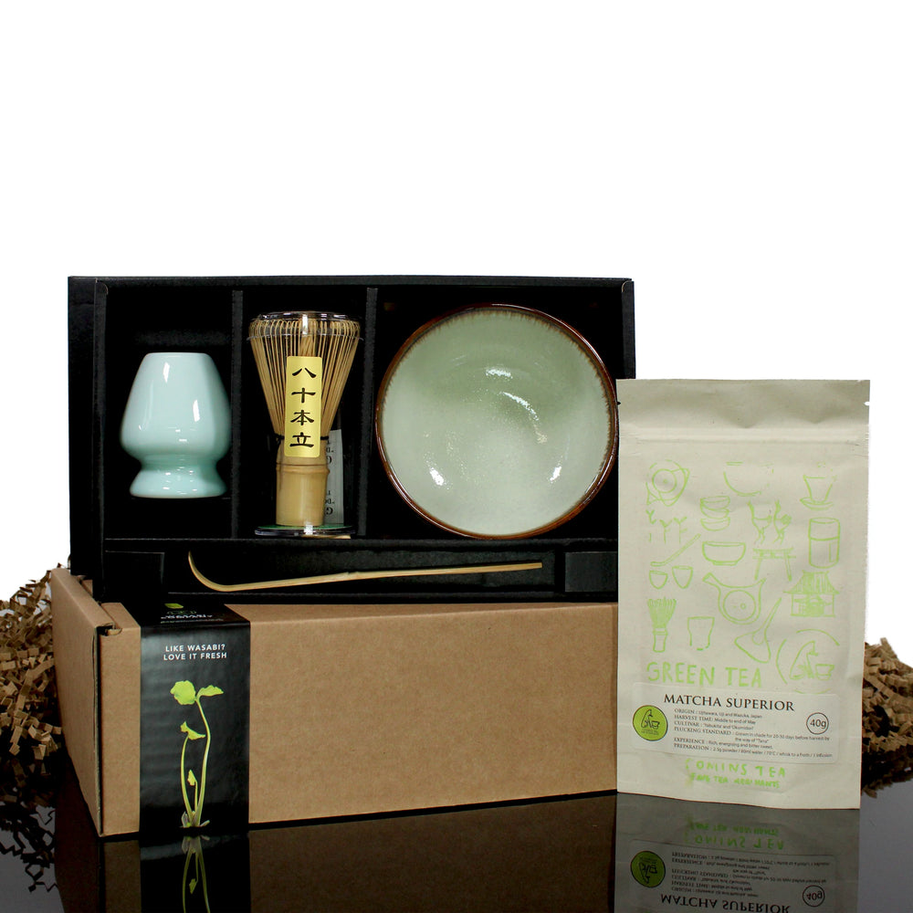 
                  
                    The Matcha Tea Set in Green with Matcha Tea includes a whisk, bowl, spoon, sifter, tea cup, and premium matcha powder, all elegantly packaged in a black and brown box for an authentic Japanese tea experience.
                  
                