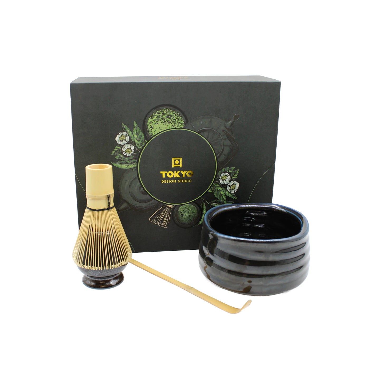 The Matcha Tea Set - Black includes a black floral gift box, a bamboo whisk, a black matcha bowl, and a bamboo scoop—an elegant set inspired by the Japanese tea ceremony.