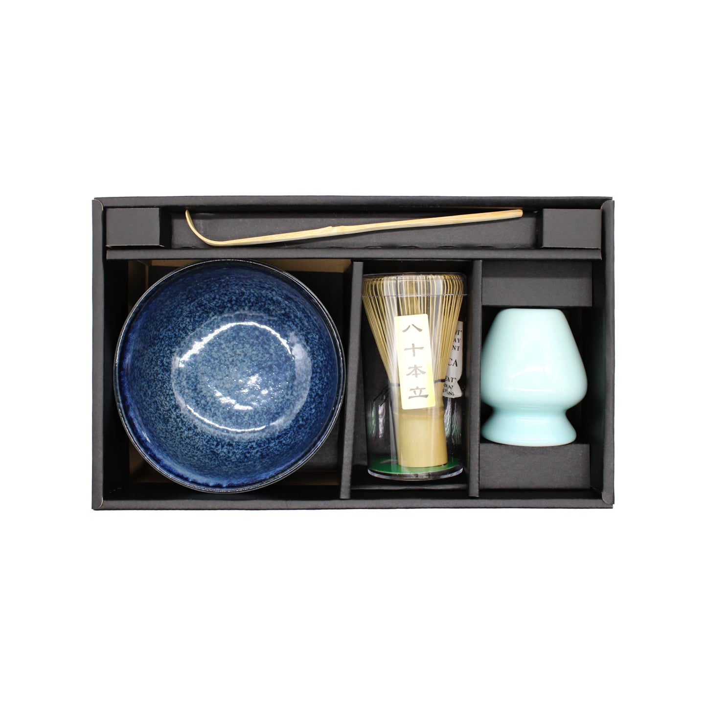 The Matcha Tea Set - Blue includes a bamboo whisk, blue ceramic bowl, ceramic whisk holder, and bamboo scoop, each in its own compartment—perfect for Japanese tea making.