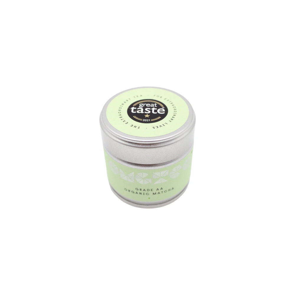 
                  
                    A silver tin labeled Grade AA Organic Matcha Tea -30g, filled with premium Japanese matcha, features a green lid adorned with a Great Taste 2017 award sticker.
                  
                