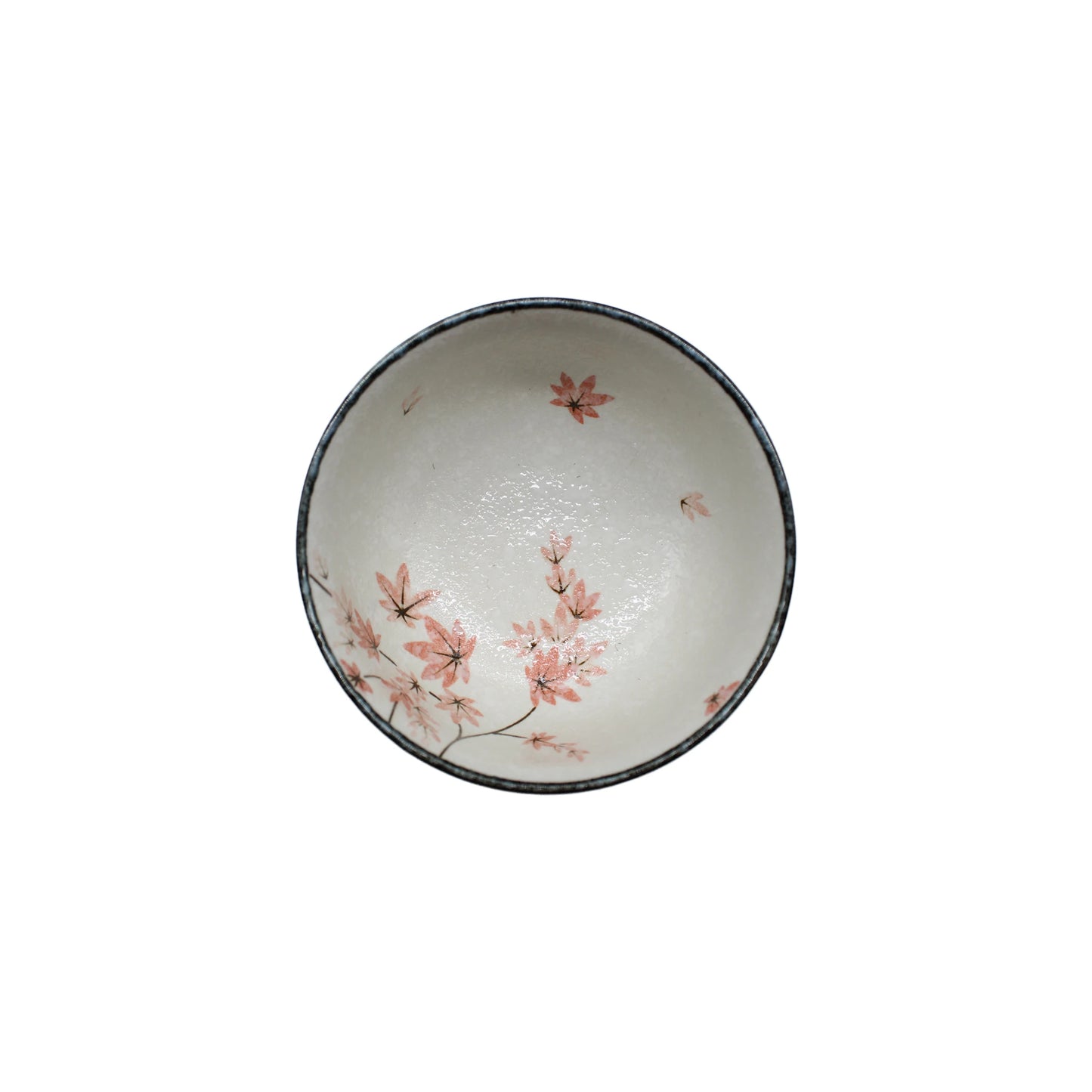 The Matcha Tea Set - Maple Leaf features a ceramic bowl with a white interior, pink floral pattern, and dark rim—ideal for Japanese tea ceremonies or as part of your matcha set, beautifully displayed from above.