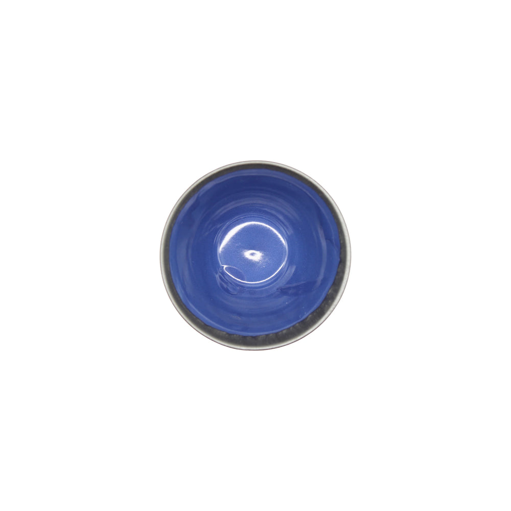 
                  
                    The Sencha Tea Cup features a round ceramic shape with a glossy indigo blue interior and metallic gray rim, reminiscent of traditional Japanese teacups, shown from above against a white background.
                  
                
