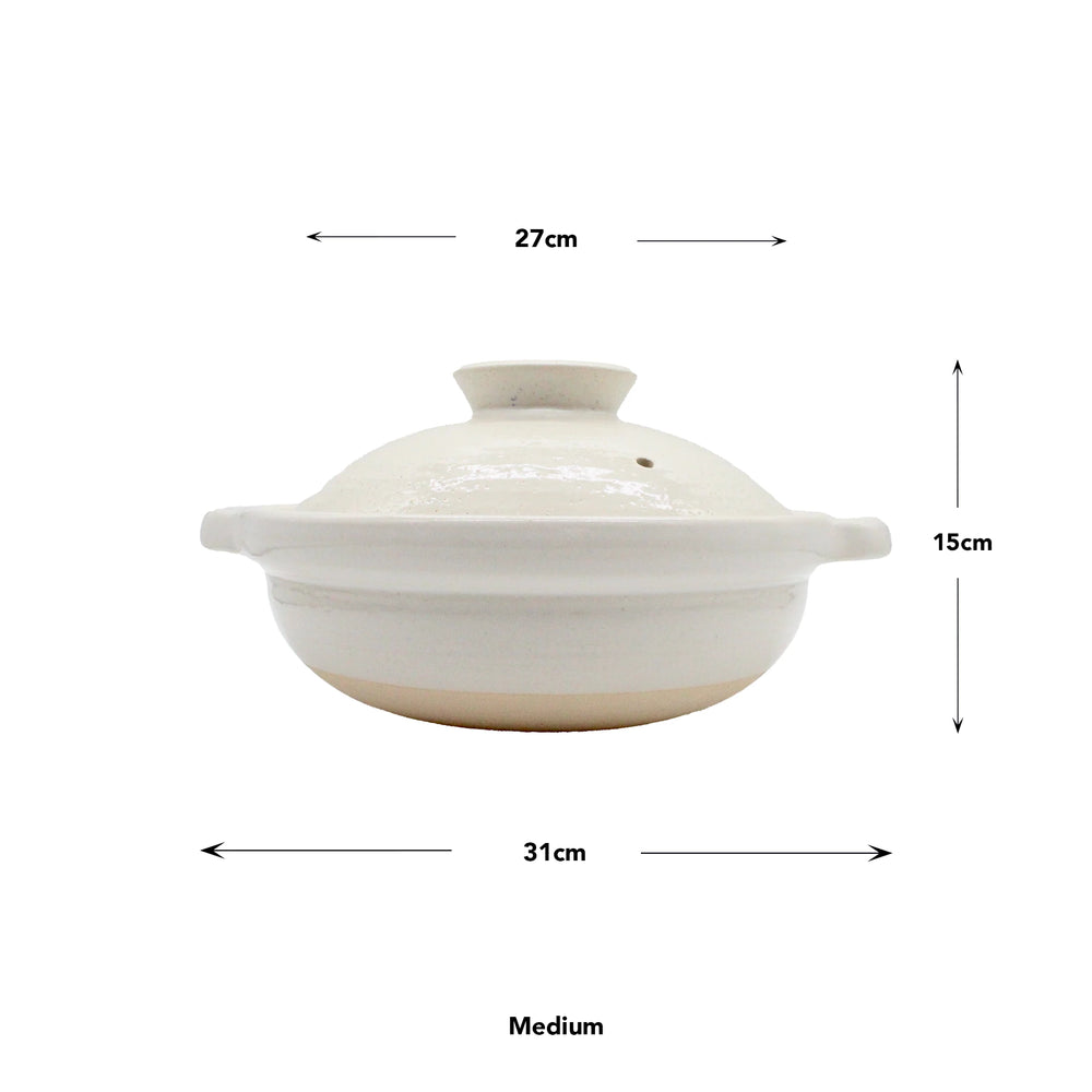 
                  
                    Side view of the Iga Clay Cooking Pots – White Glaze, Medium size, with lid. Crafted from Iga clay, this Japanese hotpot measures 27 cm wide, 31 cm long, and 15 cm tall.
                  
                