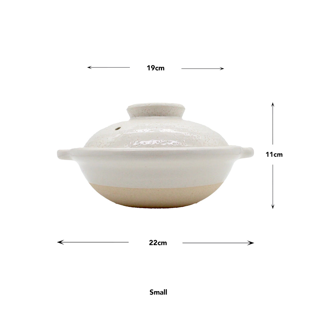 
                  
                    Iga Clay Cooking Pots - White Glaze: Small white ceramic donabe with lid, inspired by Japanese hotpot. Measures 22cm wide, 19cm diameter, and 11cm tall; arrows indicate dimensions.
                  
                