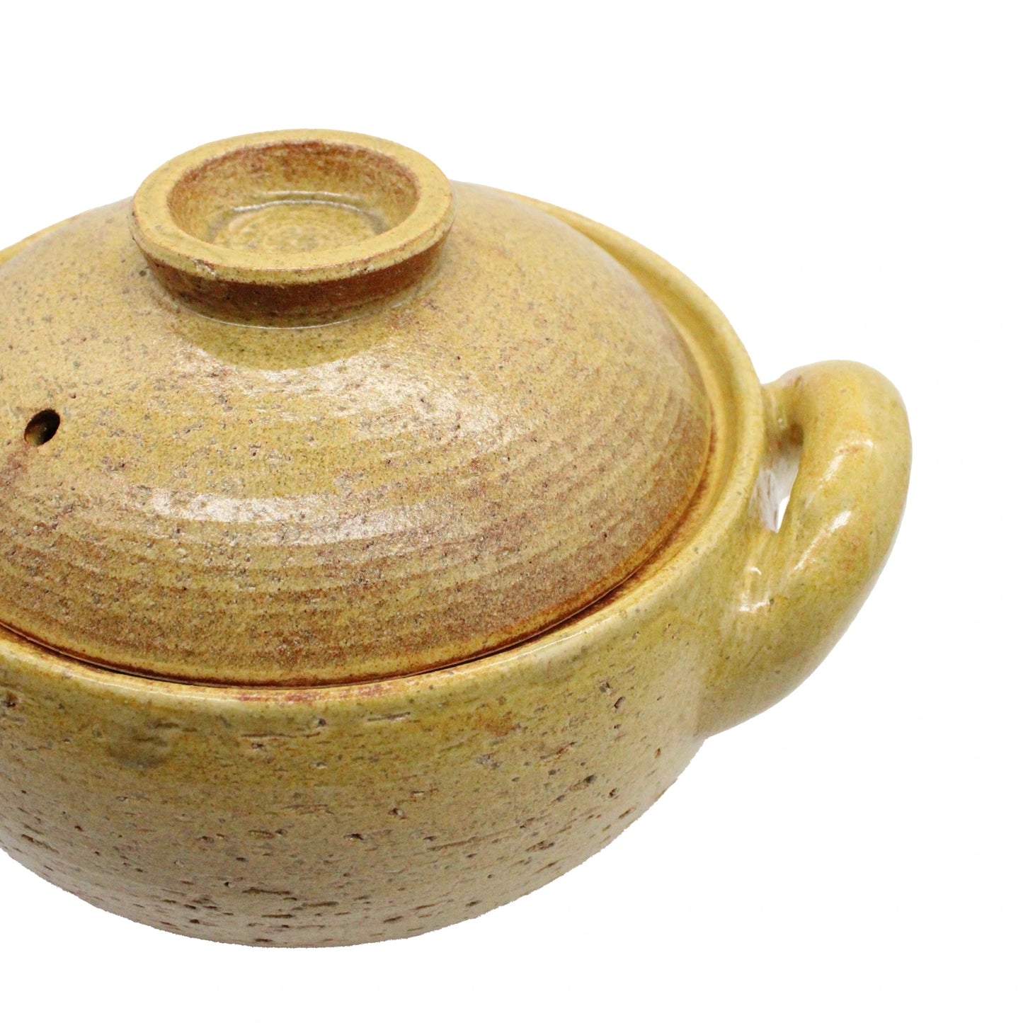 
                  
                    A close-up of a yellowish-brown handcrafted Miso Soup Pot, a traditional Japanese clay pot with a fitted lid and single handle, photographed against a white background.
                  
                