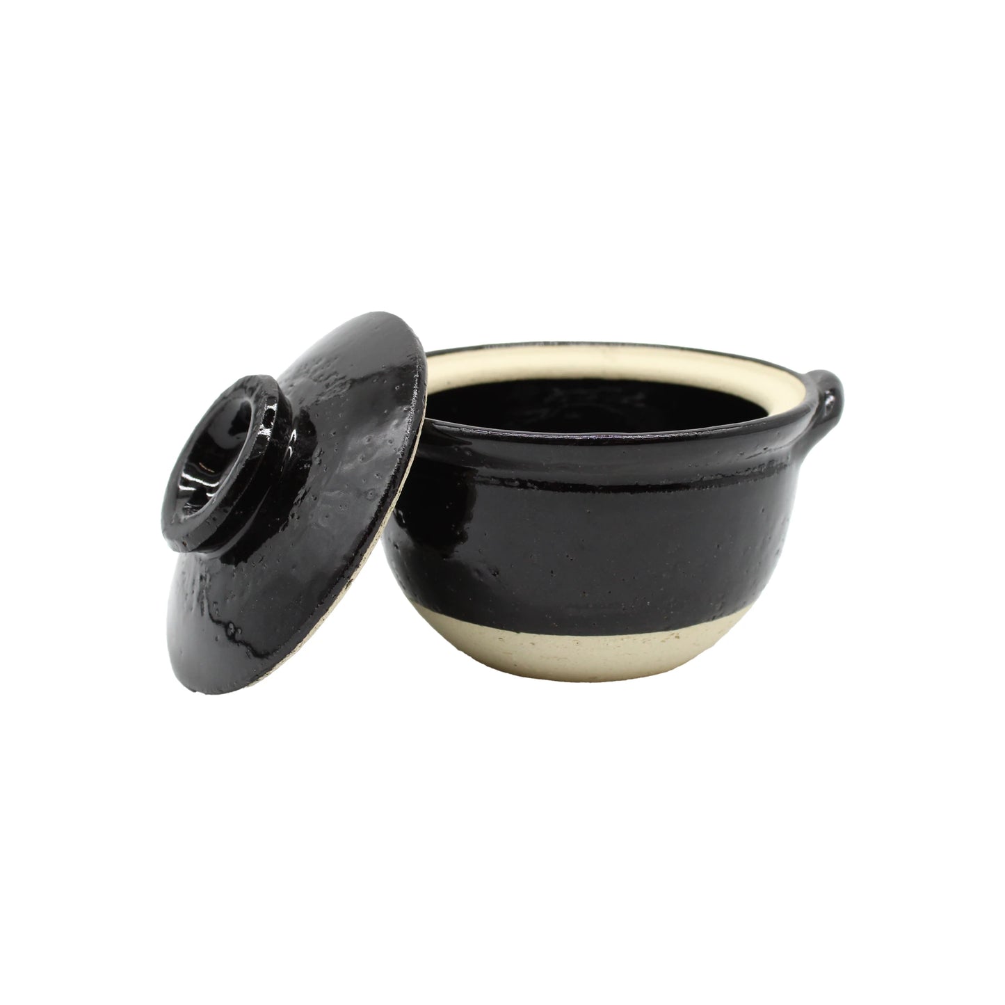 
                  
                    Mini Donabe Pot - Black, featuring a beige base and crafted in the style of Japanese earthenware, displayed with its matching lid set to the side on a plain white background.
                  
                