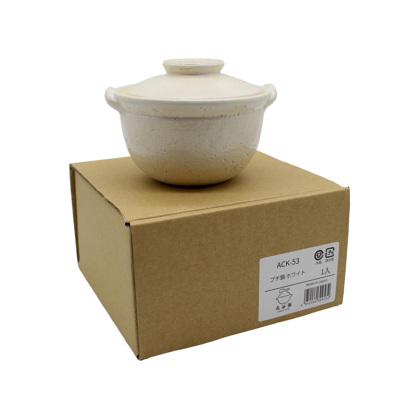 
                  
                    A Mini Donabe Pot - White with a lid rests atop a closed cardboard box labeled with product information in Japanese and English, highlighting the elegance of Japanese tableware.
                  
                