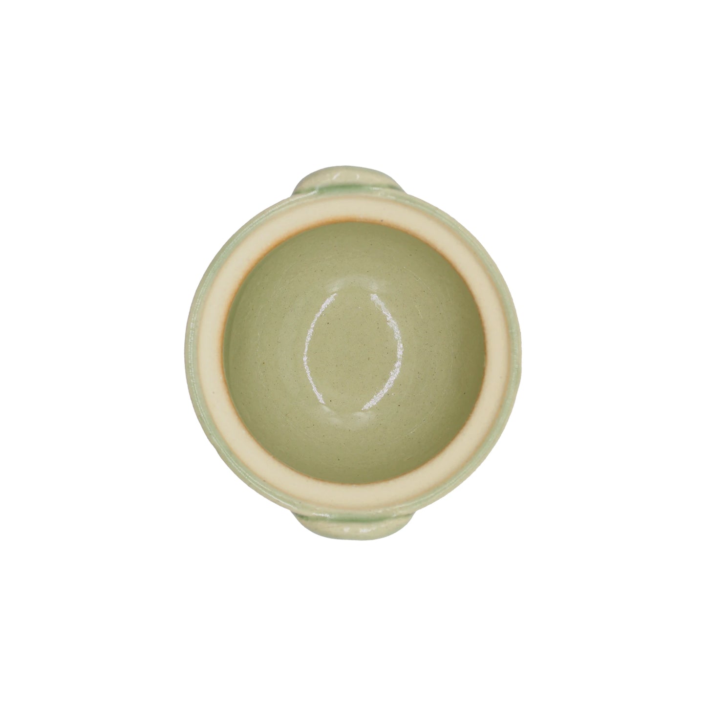
                  
                    A top view of the Mini Donabe Pot - Green, a small, round, light green ceramic bowl with two petite handles inspired by traditional Japanese tableware, photographed on a white background.
                  
                