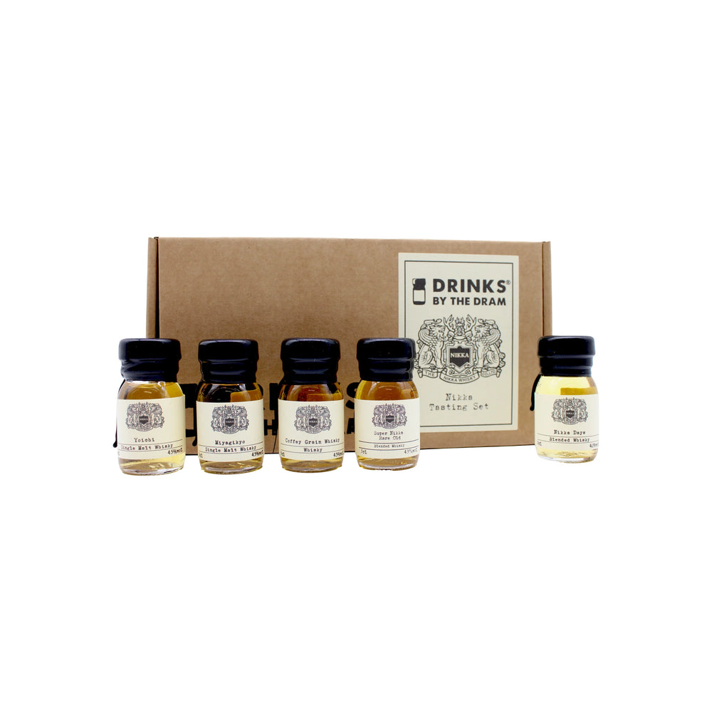 The Nikka Whisky Tasting Set features a brown Drinks by the Dram box with five small glass bottles, perfect for sampling Nikka Whisky and other renowned Japanese whisky selections.
