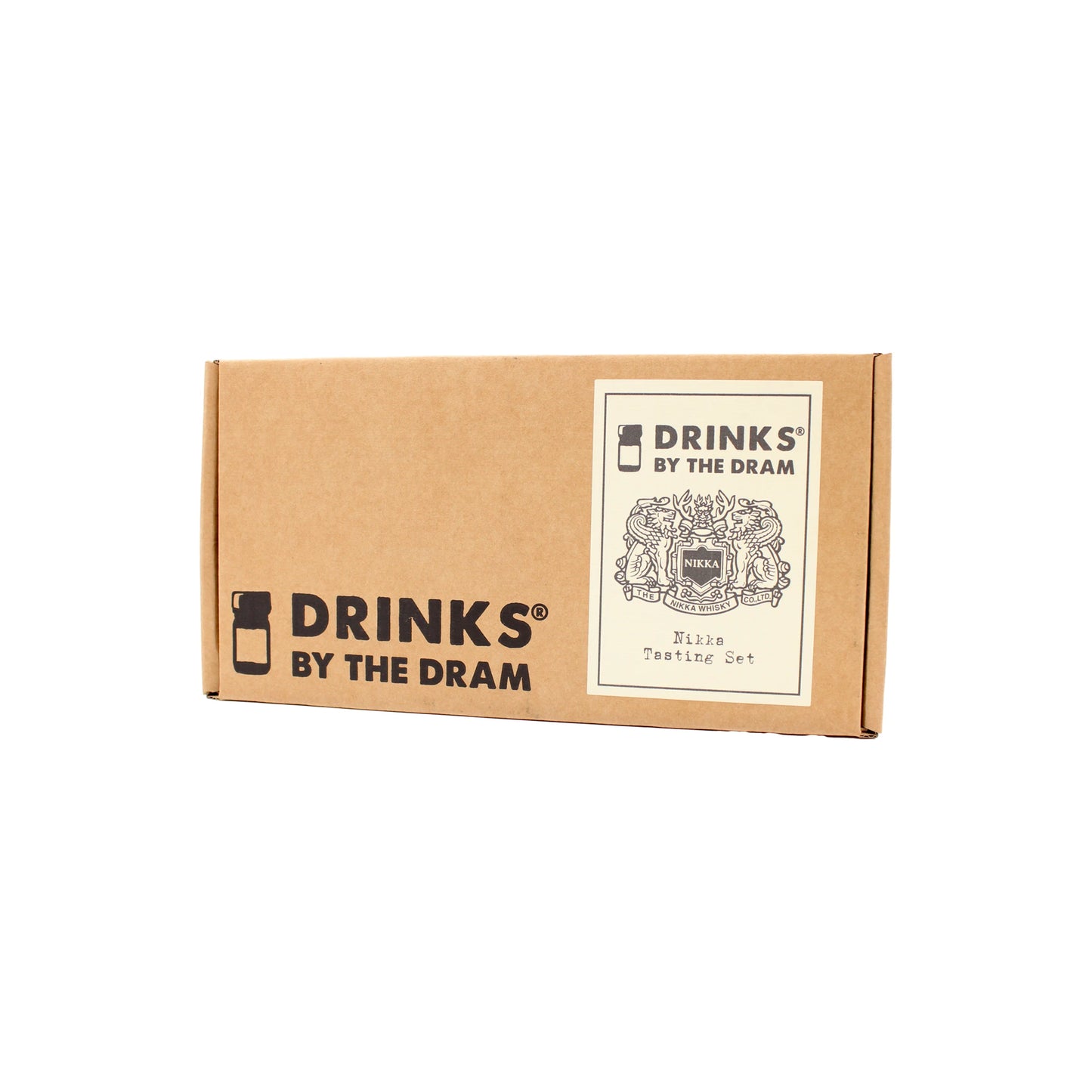 
                  
                    A rectangular brown cardboard box labeled Drinks by the Dram with a white sticker featuring a decorative crest and Nikka Whisky Tasting Set—a perfect introduction to Japanese whisky.
                  
                