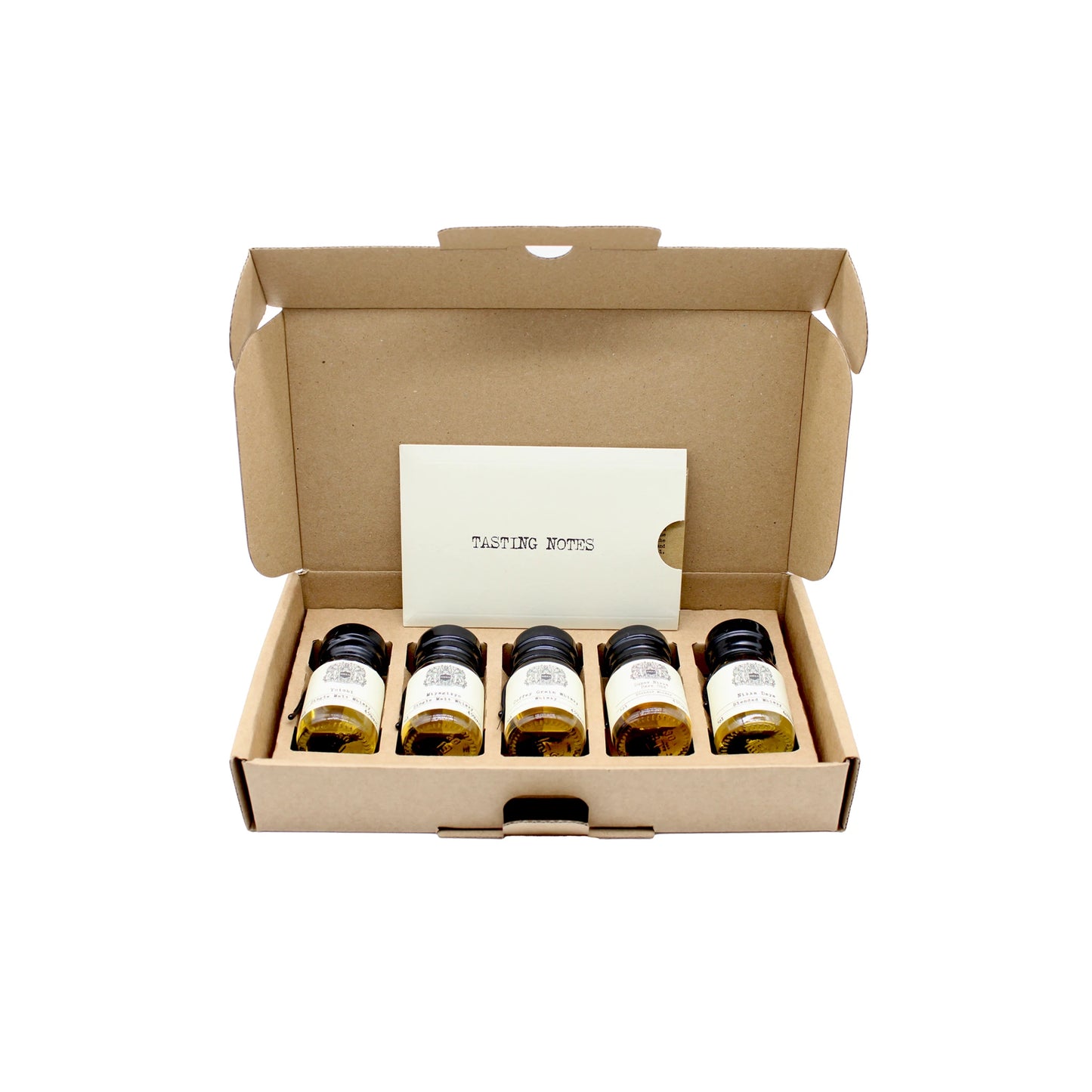 An open cardboard box displays five small bottles with labels and a TASTING NOTES card inside, perfect as the Nikka Whisky Tasting Set featuring Japanese whisky.