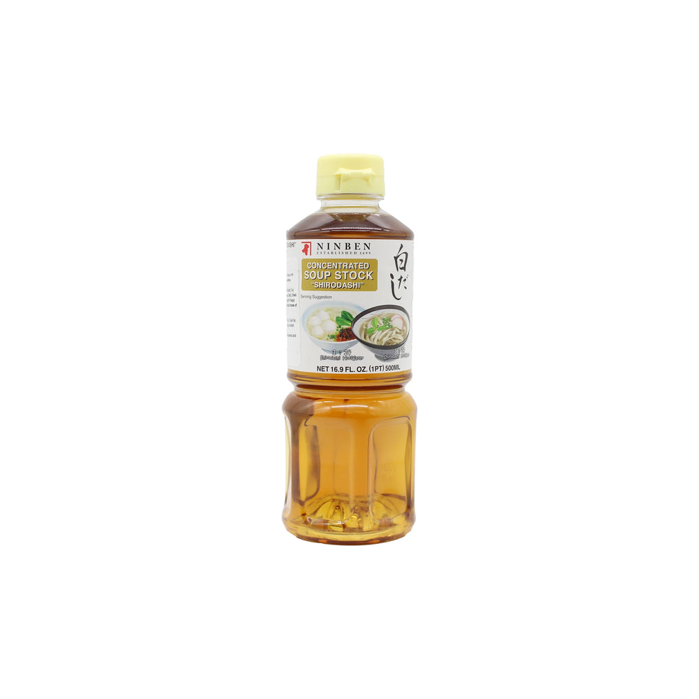 A 16.9 fl oz (500 ml) plastic bottle of Ninben Shiro Dashi Gold concentrated soup stock, rich in umami from bonito flakes, with a yellow cap and labeled packaging.