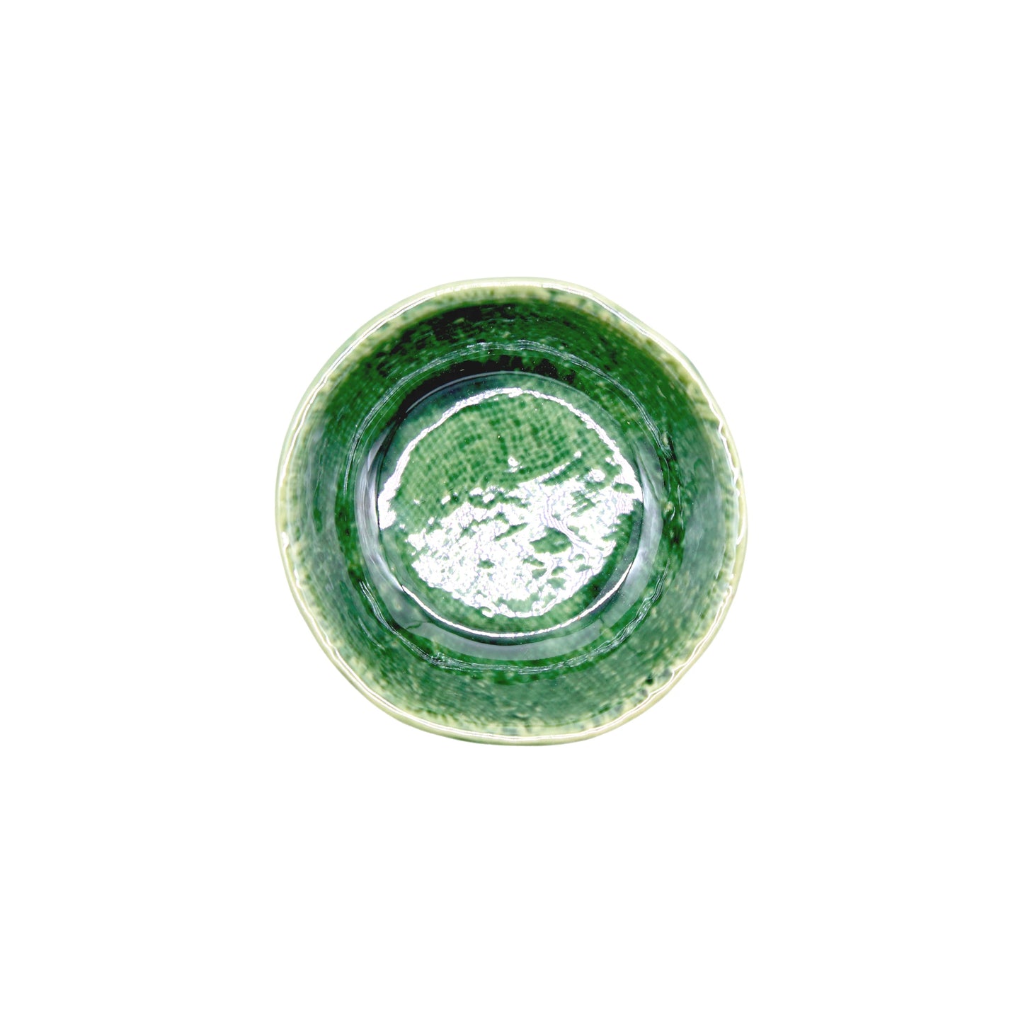 
                  
                    The Soy Sauce Dish - Oribe Green is a round ceramic bowl with a textured interior in varying green shades and a slightly uneven rim, inspired by traditional Oribe ware Japanese pottery, shown from above against a white background.
                  
                