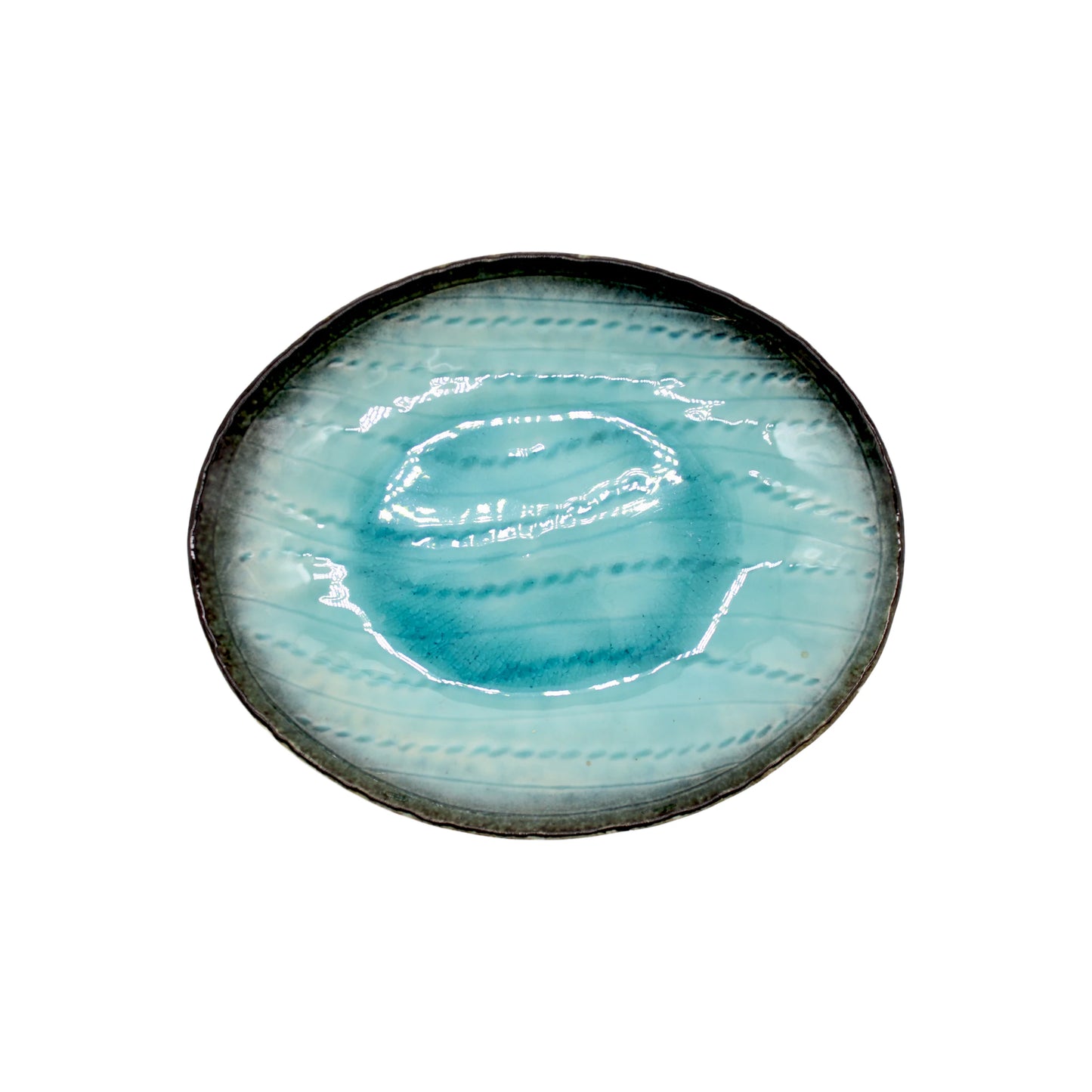 The Sky Blue Oval Plate - 24cm is crafted from Minoyaki porcelain, featuring a glossy, hand-applied sky blue glaze with subtle wavy patterns on a white background.