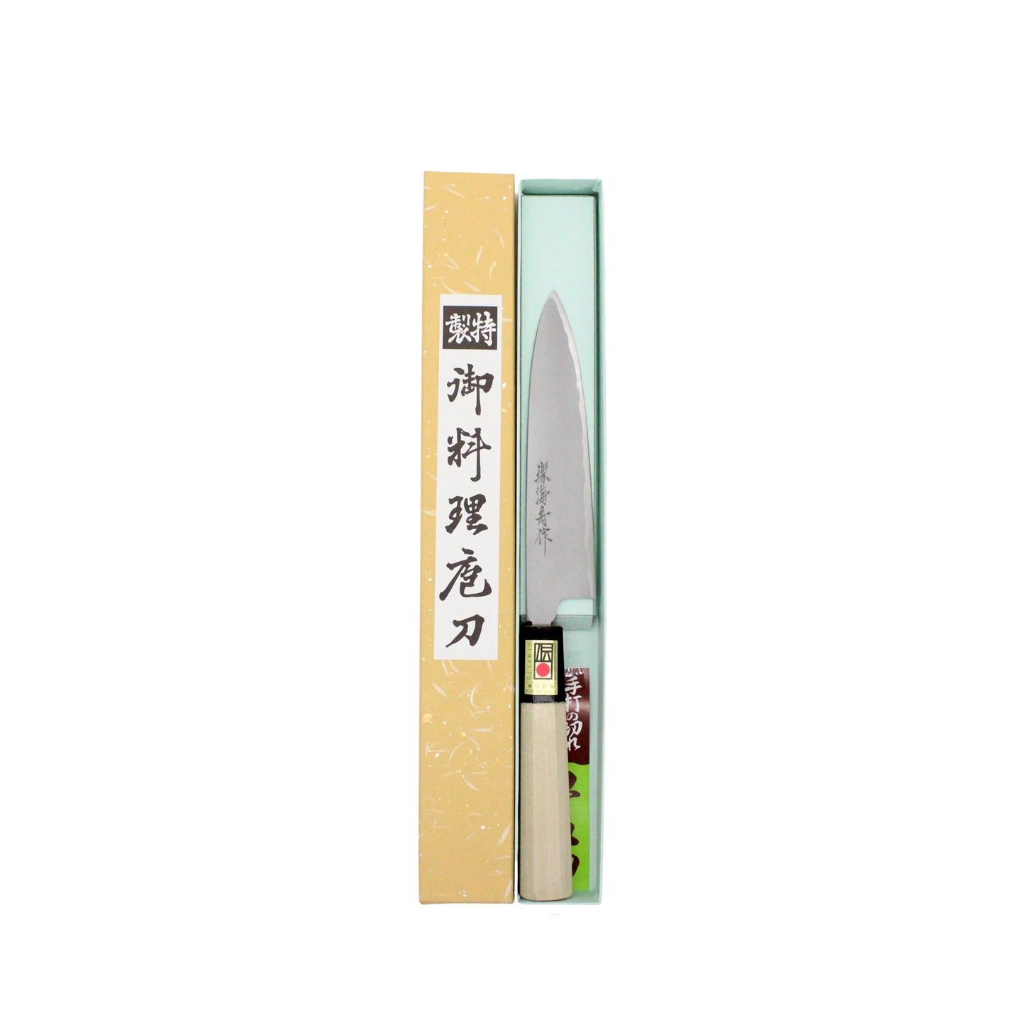 
                  
                    The Petty Paring Knife Migaki Polished - 150mm features a double-bevel edge, a light-colored handle, and comes in an open rectangular box. Japanese writing appears on its white steel blade and the box.
                  
                