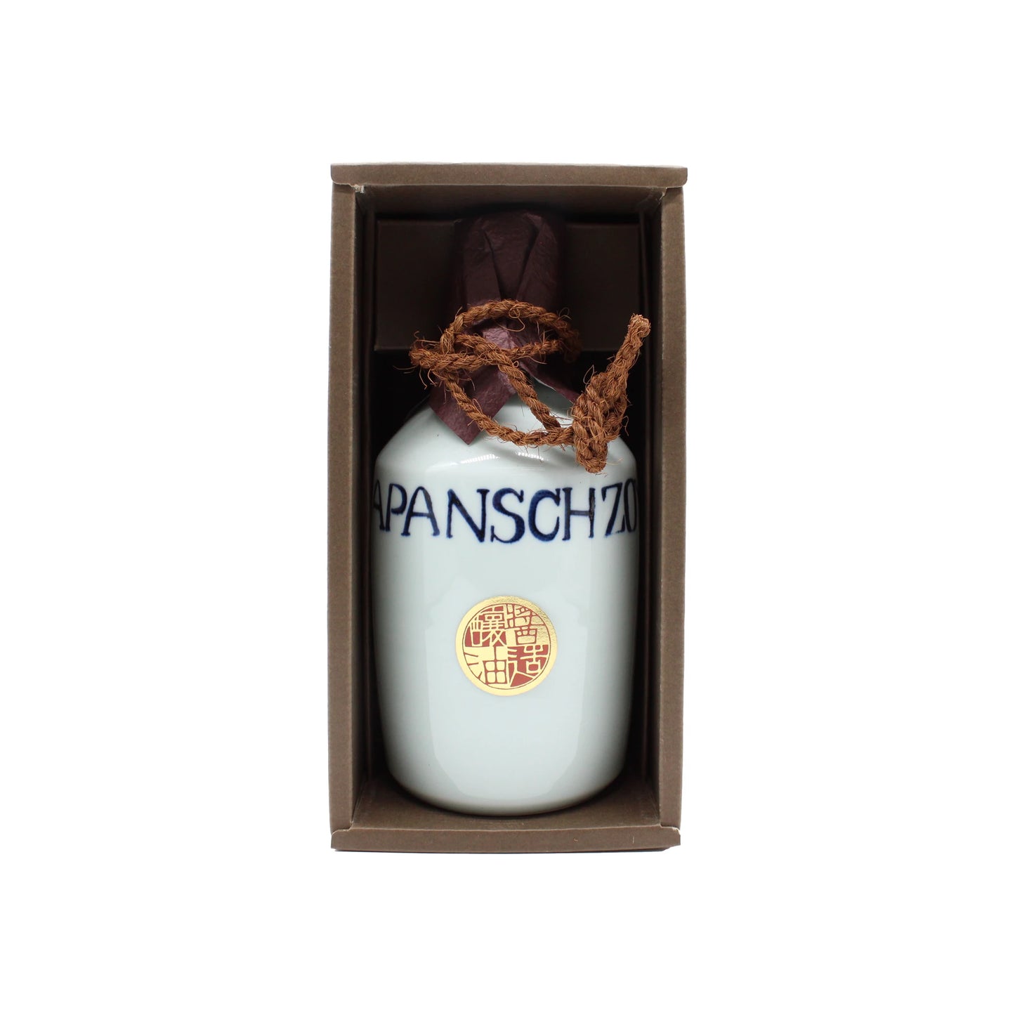 
                  
                    A white ceramic carafe of Premium Mitsuboshi Shoyu Soy Sauce (900ml) with blue JAPANSCH ZAKY lettering, sealed with brown paper and twine, is displayed upright in a cardboard box.
                  
                