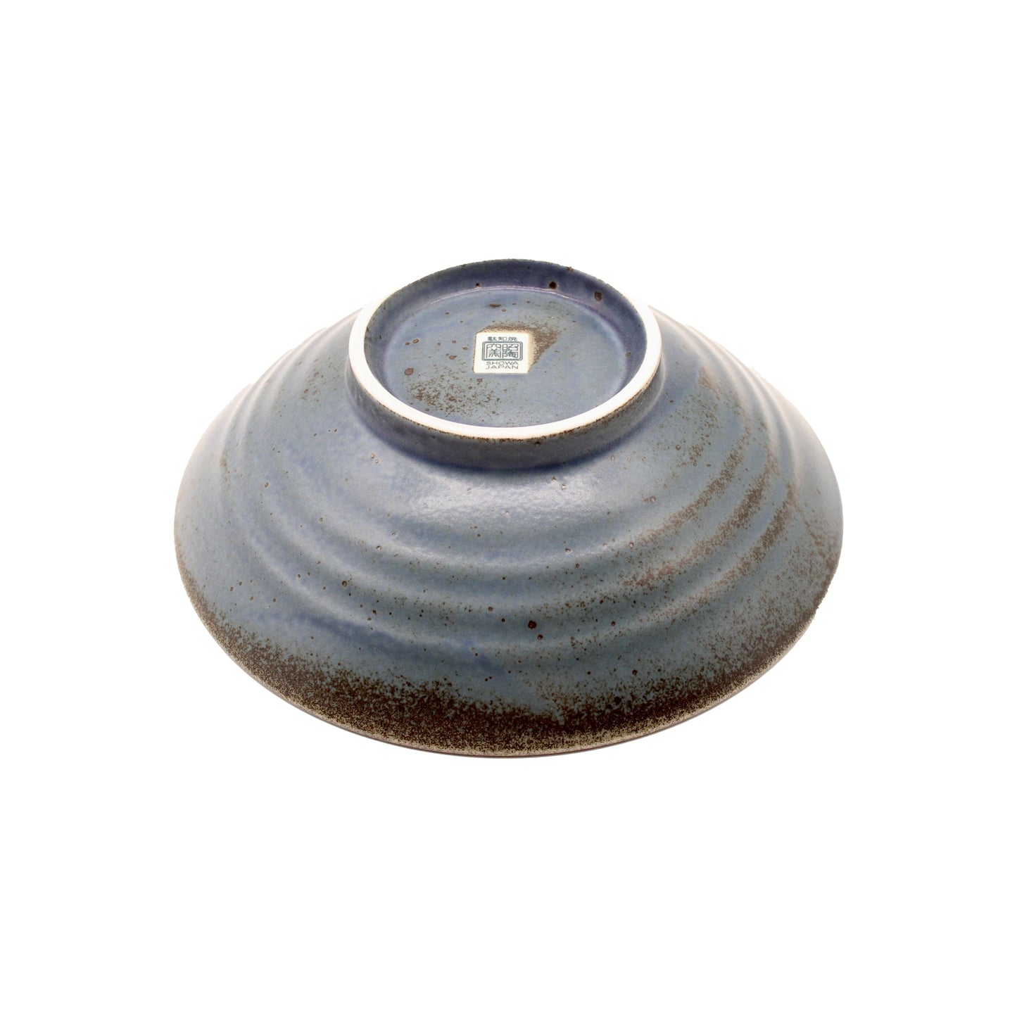 
                  
                    The Ramen Bowl - Blue Etched Lines is shown upside down, revealing its unglazed foot ring and a small maker’s mark sticker on the base, set against a white background.
                  
                