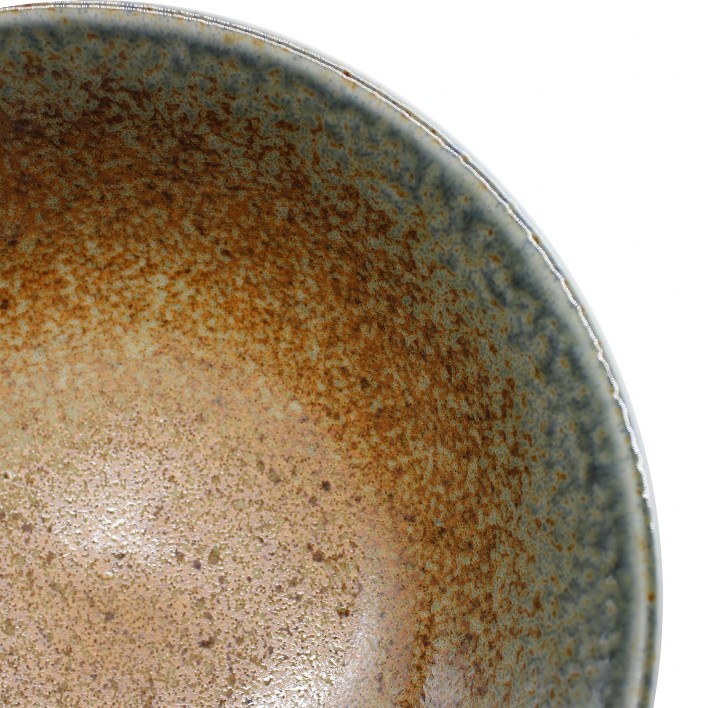 
                  
                    Close-up of the Ramen Bowl - Brown and Blue, featuring a speckled brown and blue glaze, with part of the curved rim and textured inner surface visible.
                  
                