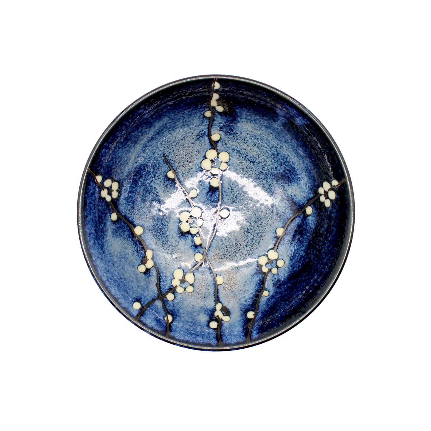 The Ramen Bowl - Blue Cherry Blossom features a deep blue glaze with white cherry blossom and branch motifs on the inside, capturing the refined beauty of Japanese artistry.