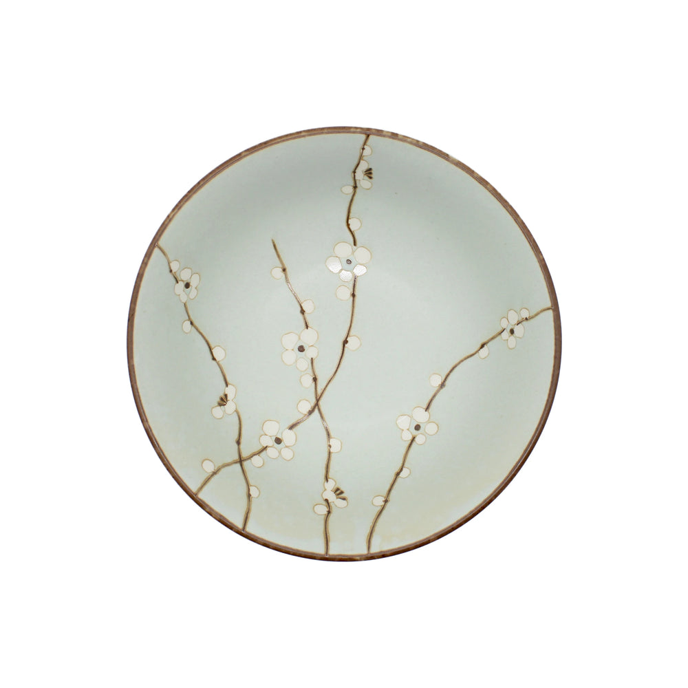 The Ramen Bowl - Light Green Cherry Blossom features a light green glaze, brown rim, and elegant white cherry blossoms. Its versatile size complements Japanese porcelain ramen bowls for stylish serving.