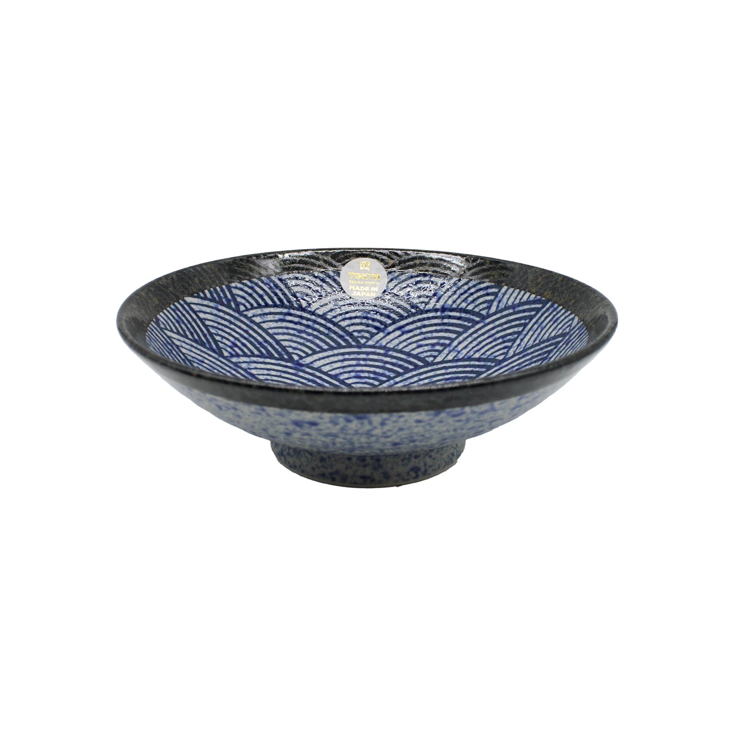 
                  
                    The Ramen Bowl - Blue Wave is a handmade Japanese Minoyaki porcelain bowl featuring a blue and white wave pattern and a dark base, shown on a white background.
                  
                