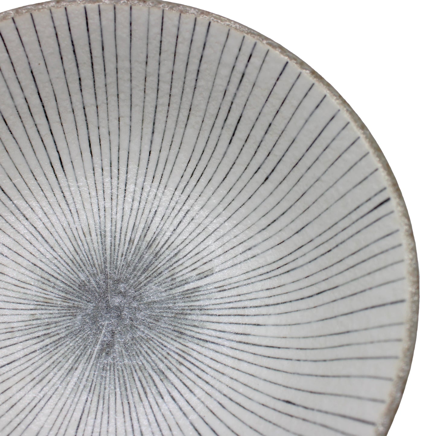 
                  
                    Close-up of the Ramen Bowl - Lined Earth, a handcrafted noodle bowl with a white glaze and thin, evenly spaced black lines radiating from the center.
                  
                