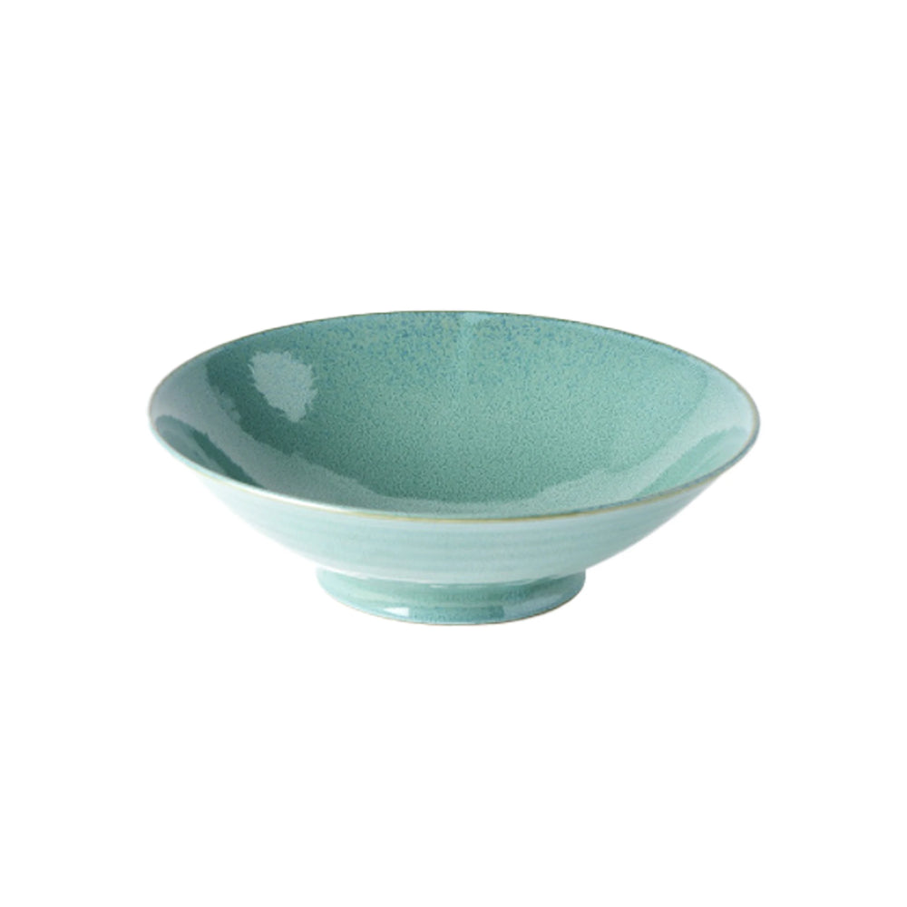 The Ramen Bowl - Peacock is a shallow, round, light green ceramic bowl with a slightly flared rim and small footed base, perfect for serving Japanese meals. Displayed against a white background.