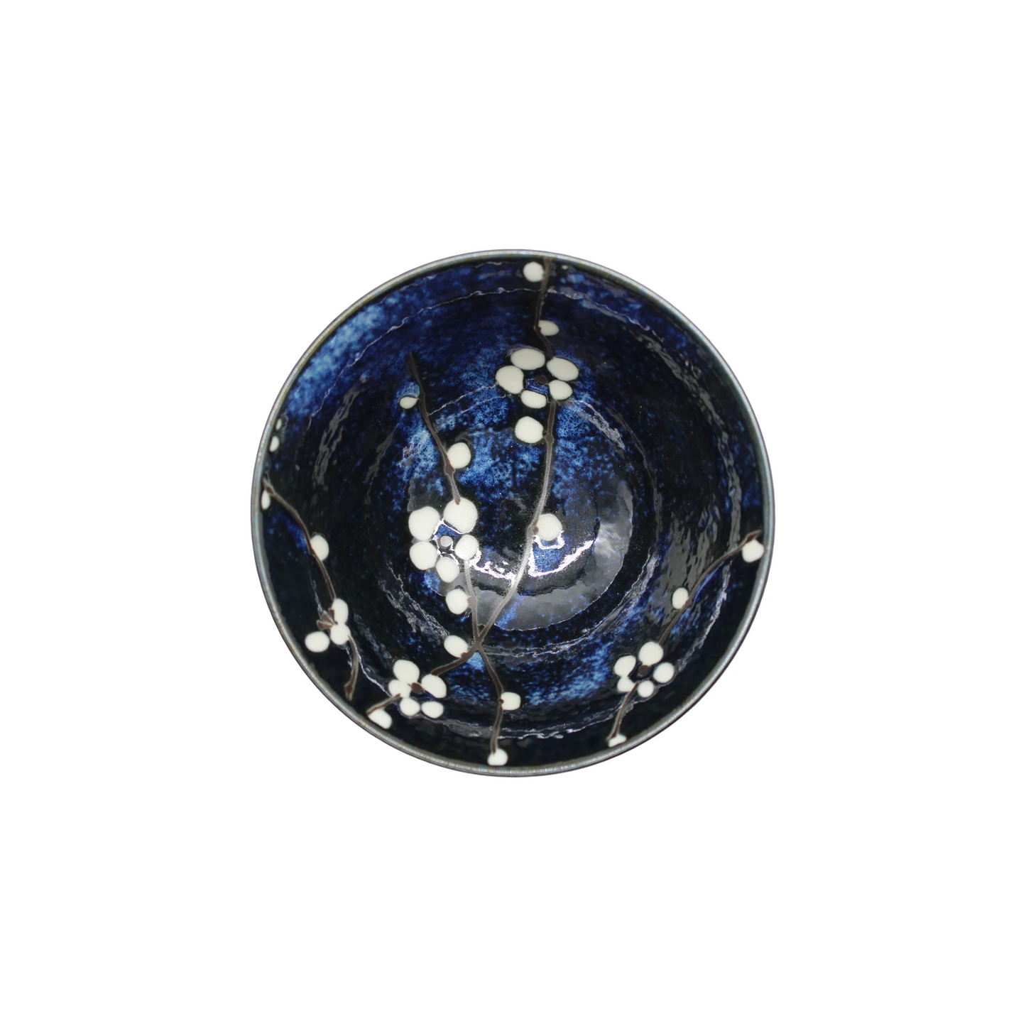 
                  
                    The Rice Bowl - Blue Cherry Blossom features a dark blue interior with a delicate white cherry blossom design, beautifully displayed on the inside surface when viewed from above.
                  
                