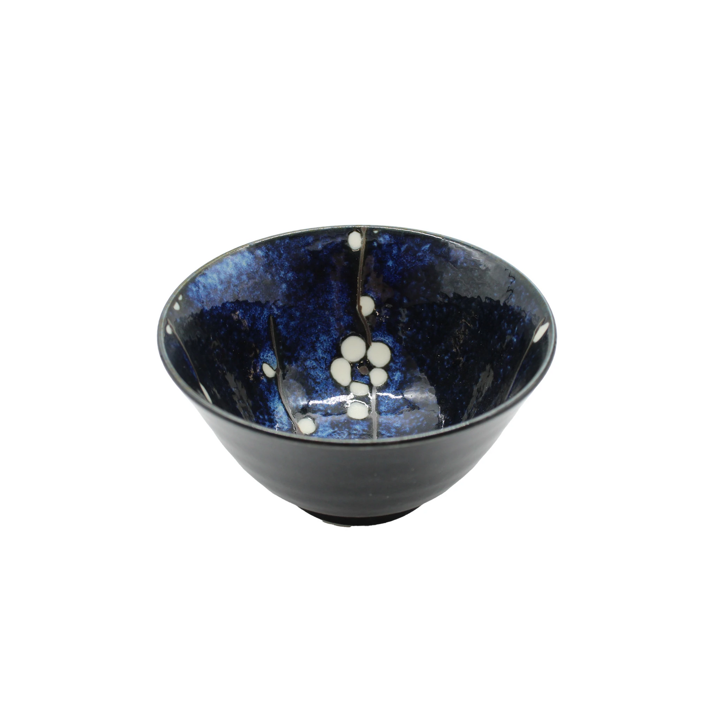 
                  
                    The Rice Bowl - Blue Cherry Blossom features dark blue porcelain with a speckled glaze and subtle white circular cherry blossom patterns on the interior.
                  
                