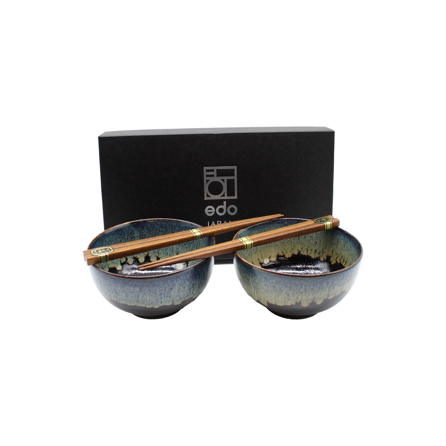 The Black Cascade Bowls Gift Set features two Japanese ceramic bowls with blue and brown glaze, each with wooden chopsticks, stylishly presented before a black edo Japan box—making it an ideal Japanese gift set.