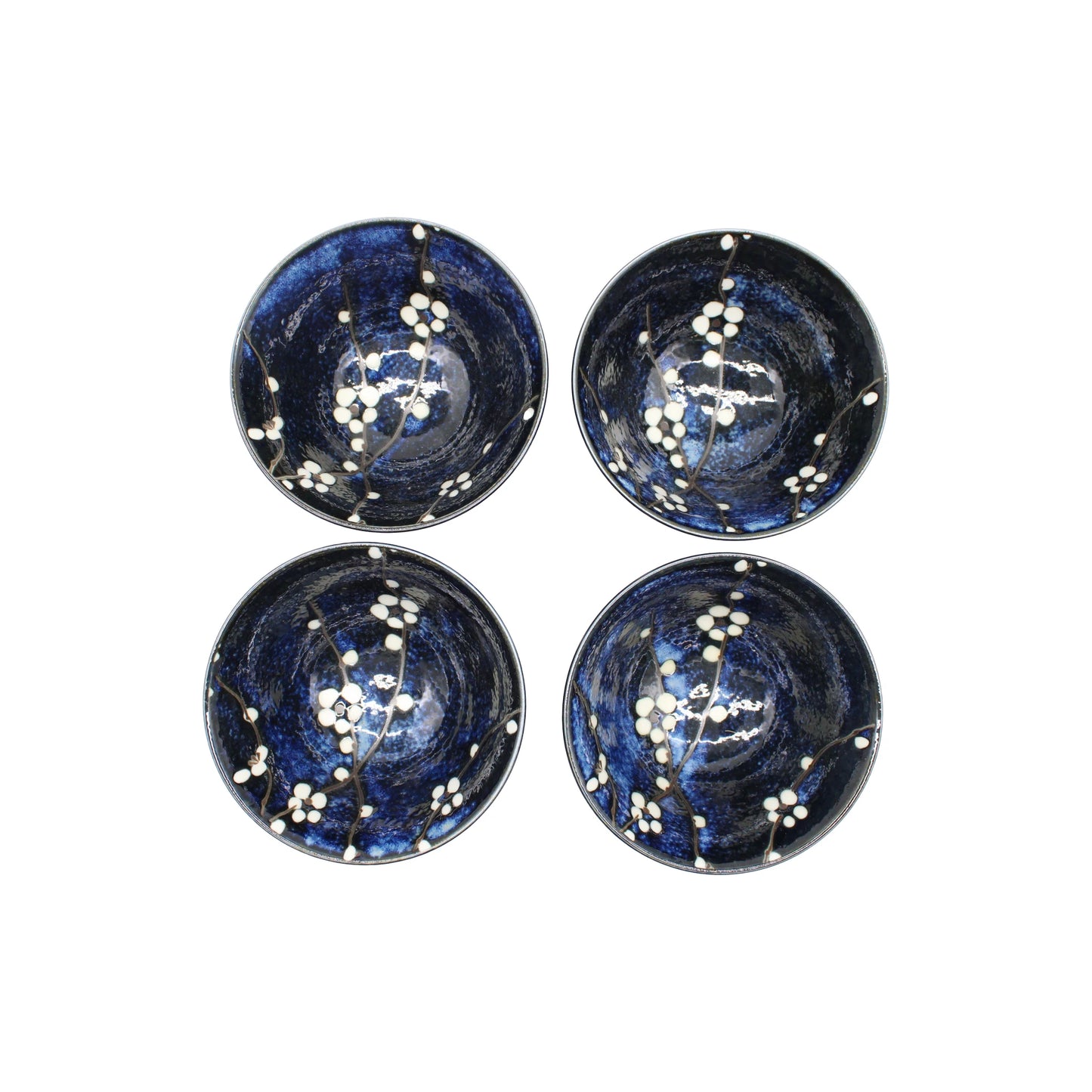 
                  
                    The Blue Cherry Blossom Rice Bowl Gift Set includes four round Japanese rice bowls with a dark blue glaze and delicate cherry blossom design, beautifully arranged for any occasion.
                  
                