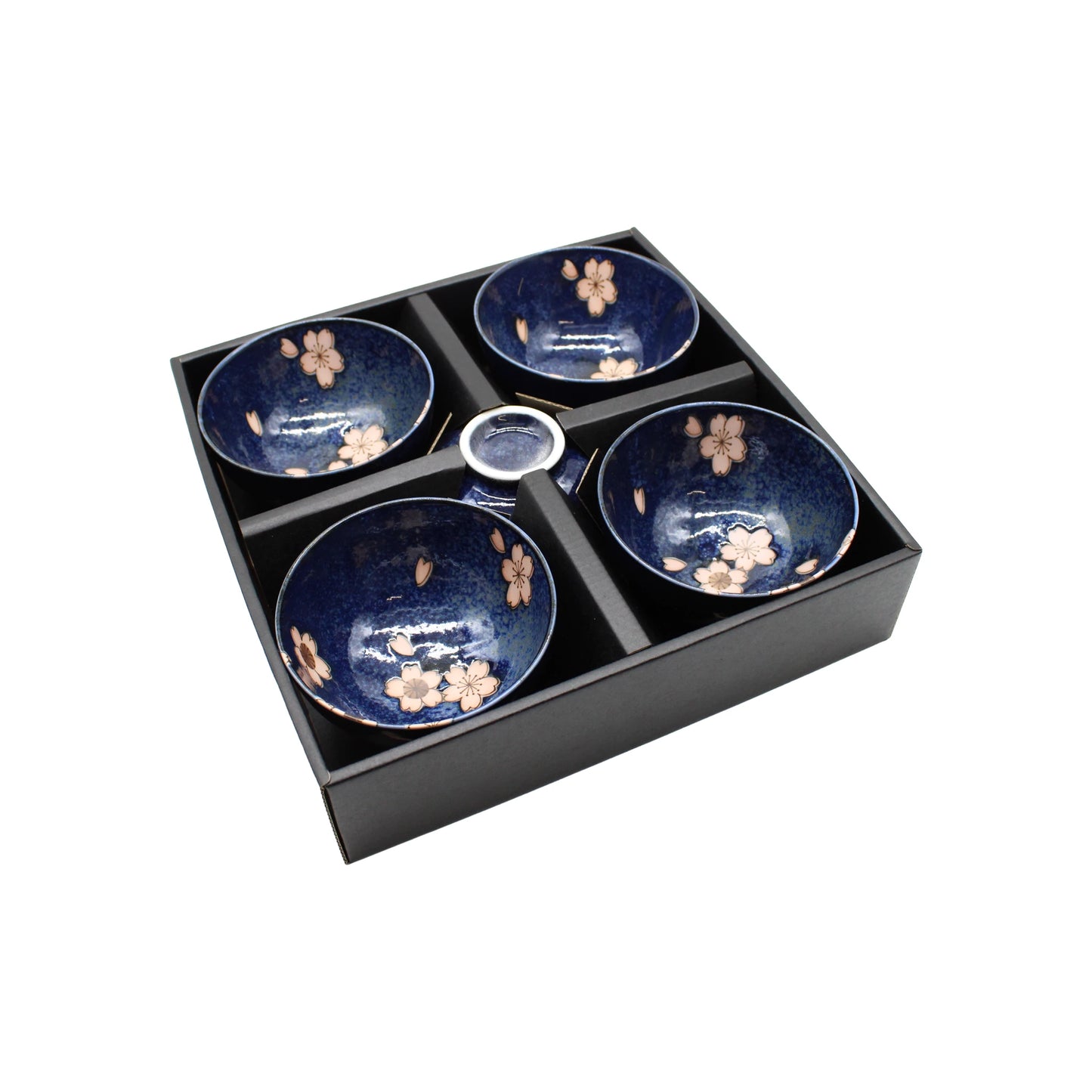The Rice Bowl Gift Set - Navy Blue & Pink Sakura features four navy blue bowls adorned with an elegant sakura (cherry blossom) design, inspired by traditional Japanese rice bowls. Each bowl is carefully placed in its own compartment within a sleek black box, making this ceramic set a perfect gift choice.