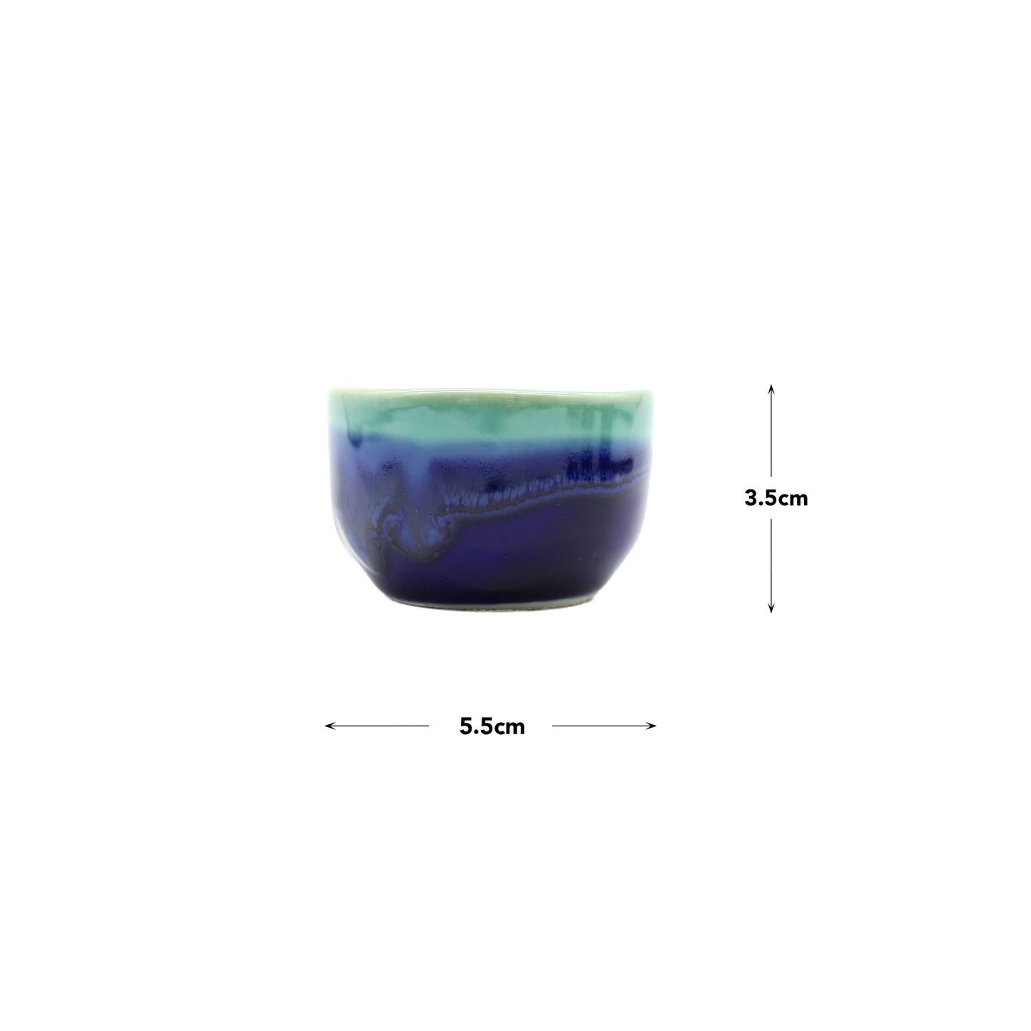 
                  
                    The Sake Gift Set For Four - Cobalt Blue & Teal features a small ceramic cup with an artisanal finish and cobalt blue glaze (5.5 cm wide, 3.5 cm tall), shown on a white background—ideal for sake lovers.
                  
                