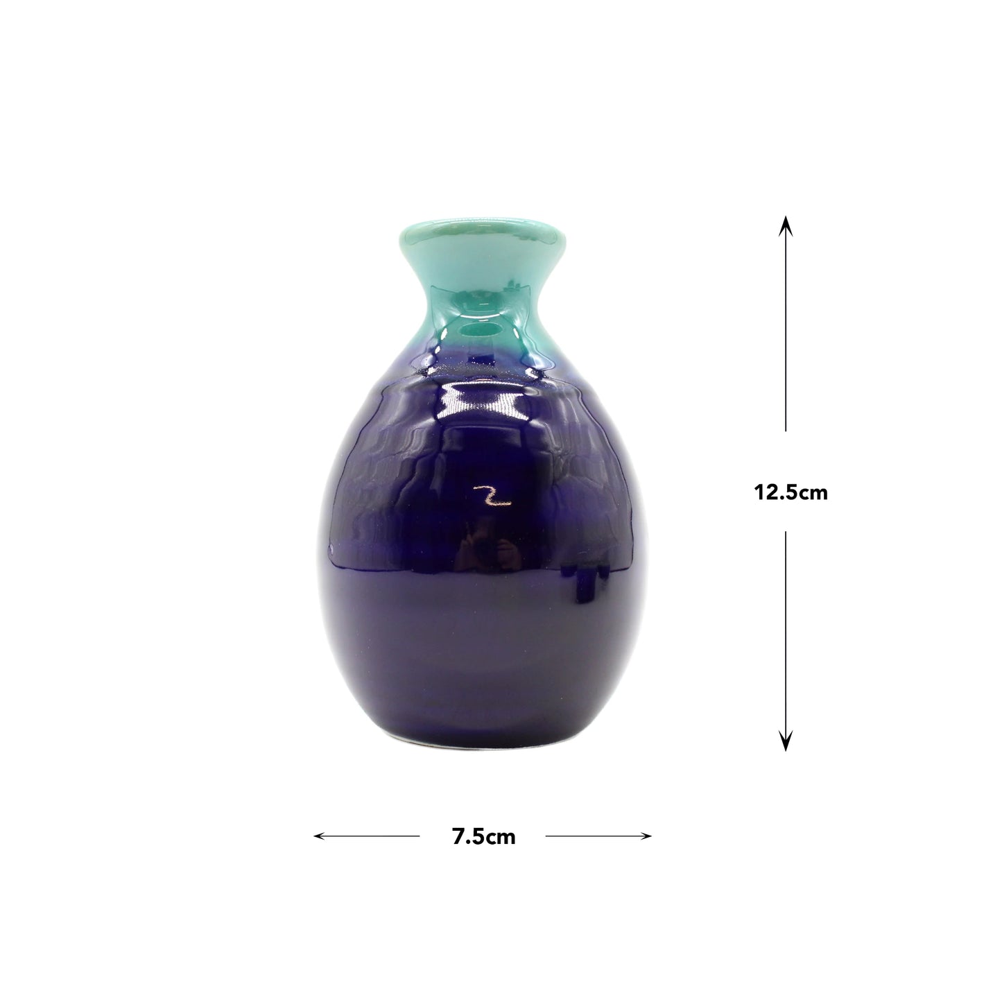 
                  
                    The Sake Gift Set For Four - Cobalt Blue & Teal features a small ceramic vase, 12.5 cm tall and 7.5 cm wide, with a cobalt blue glaze and green rim—an artisanal touch that adds uniqueness to any décor or sake collection.
                  
                