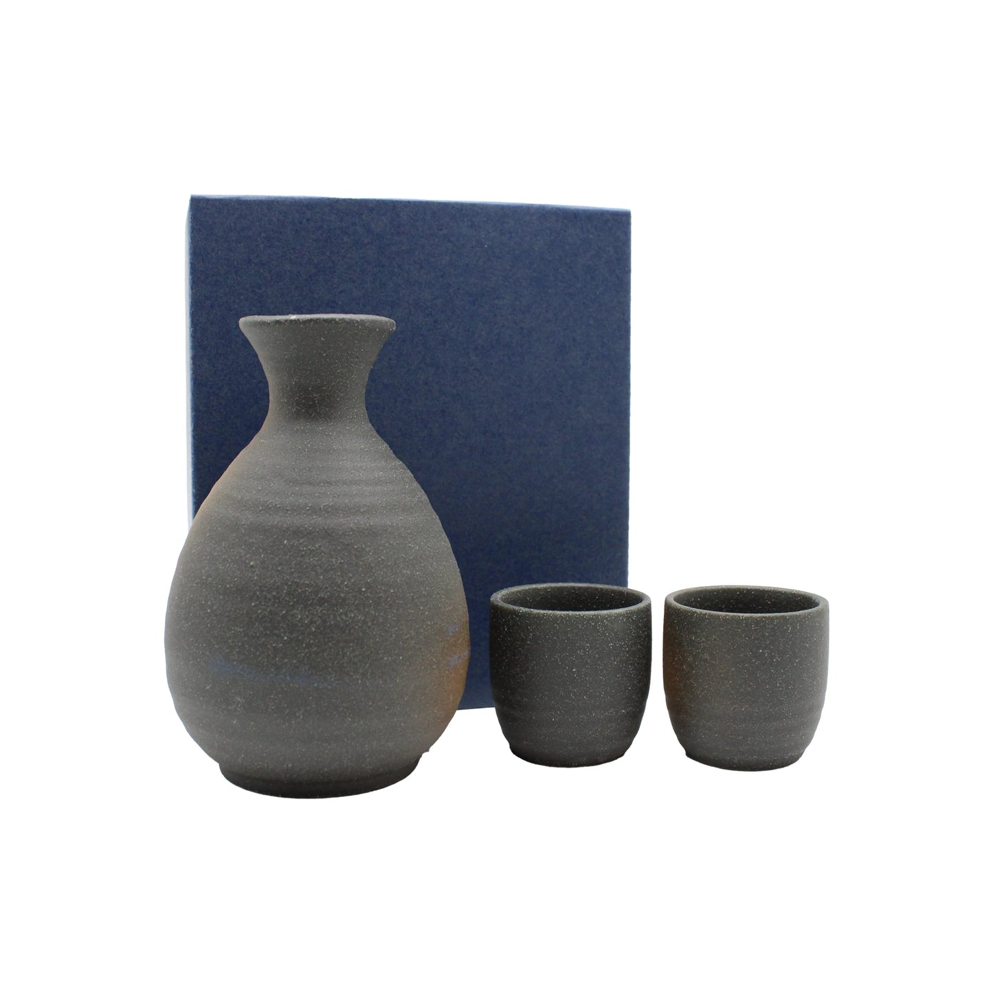 
                  
                    The Sake Gift Set For Two - Black Bizen includes a ceramic sake carafe and two cups in a gray, rustic finish, elegantly presented before a blue box.
                  
                
