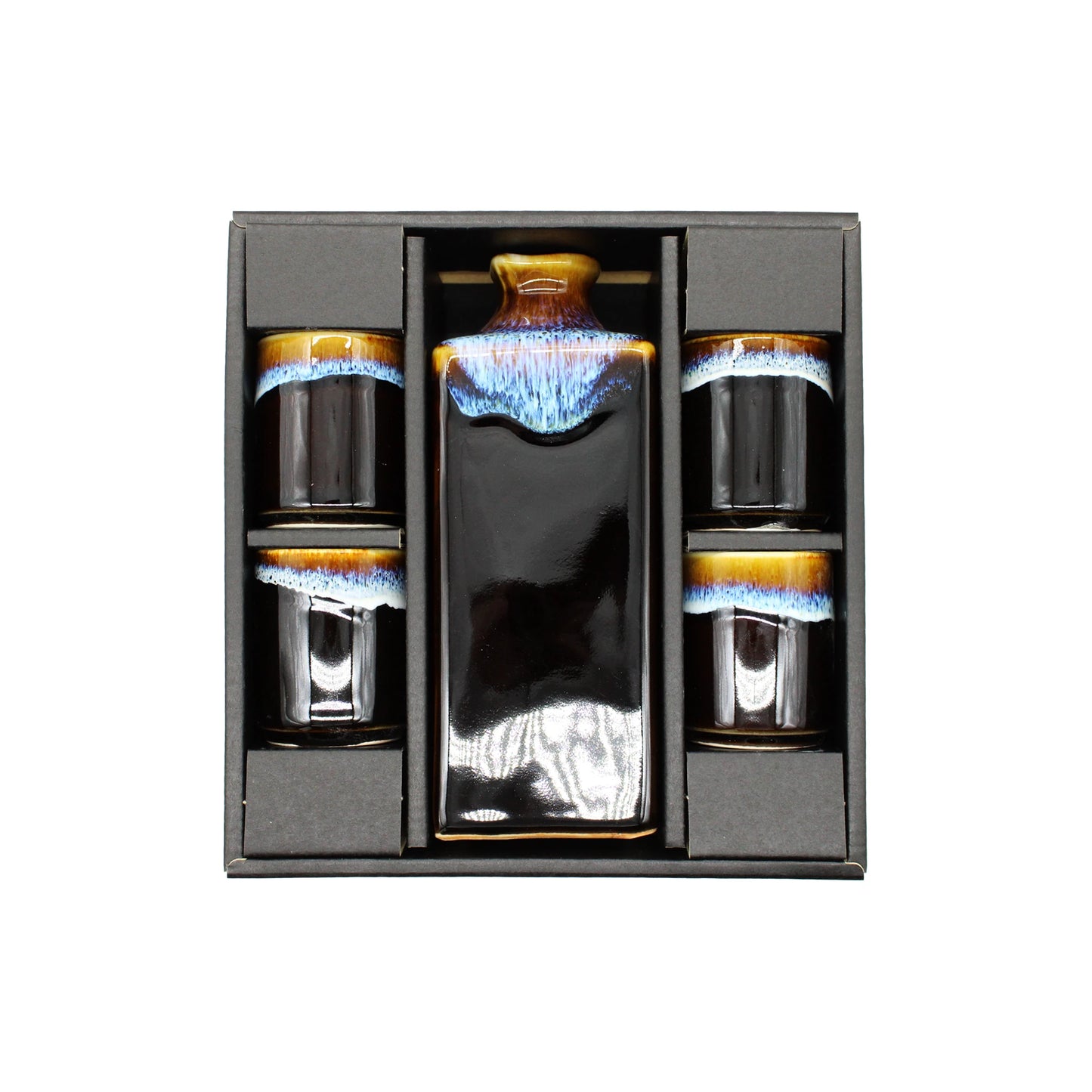 The Sake Gift Set For Four - Dark Brown & Blue Line includes a rectangular Minoyaki porcelain bottle and four matching cups with brown, blue, and white glaze, beautifully gift-boxed by Utsuwa Workshop.