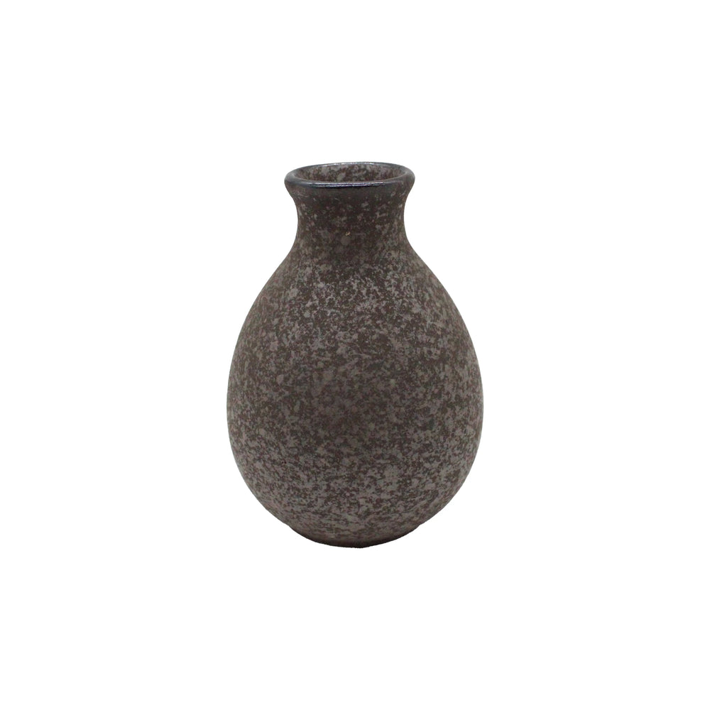 The Sake Carafe - Earth is a small, rounded Minoyaki porcelain vessel with a narrow neck and speckled dark gray finish, inspired by Japanese tradition and showcased against a plain white background.