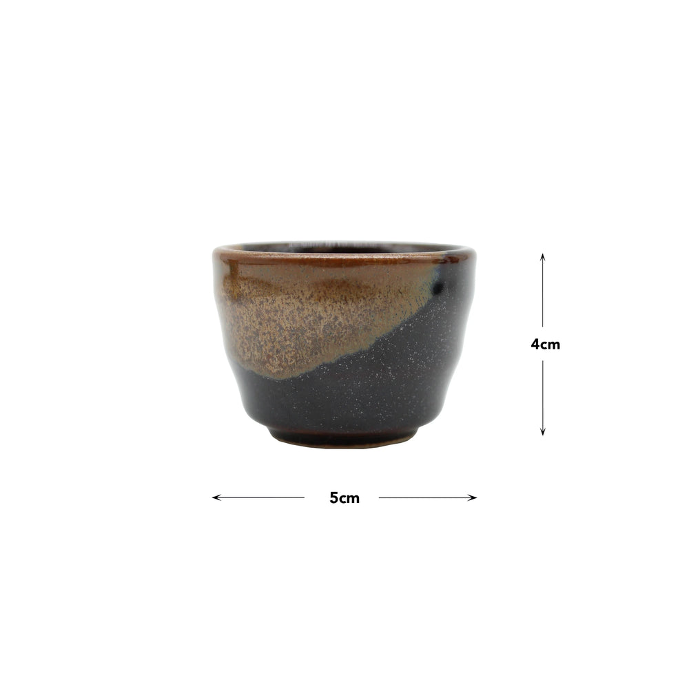 
                  
                    A set of four small Japanese ceramic sake cups (5cm diameter, 4cm height) with dark brown and black glaze—ideal for enjoying Konishi Gold Sake.
                  
                