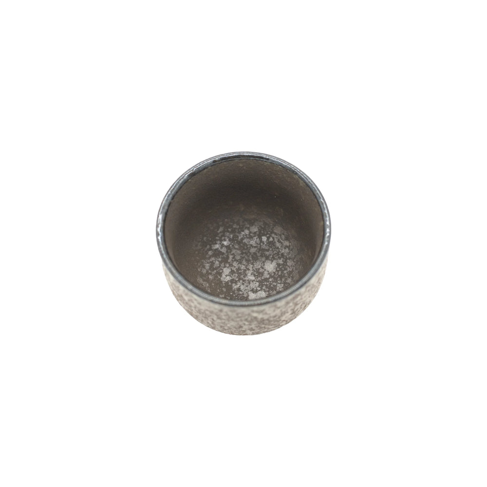 
                  
                    A top view of the Sake Cup - Earth reveals its small, round, gray ceramic form with a textured, mottled surface, highlighting Japanese craftsmanship against a plain white background.
                  
                