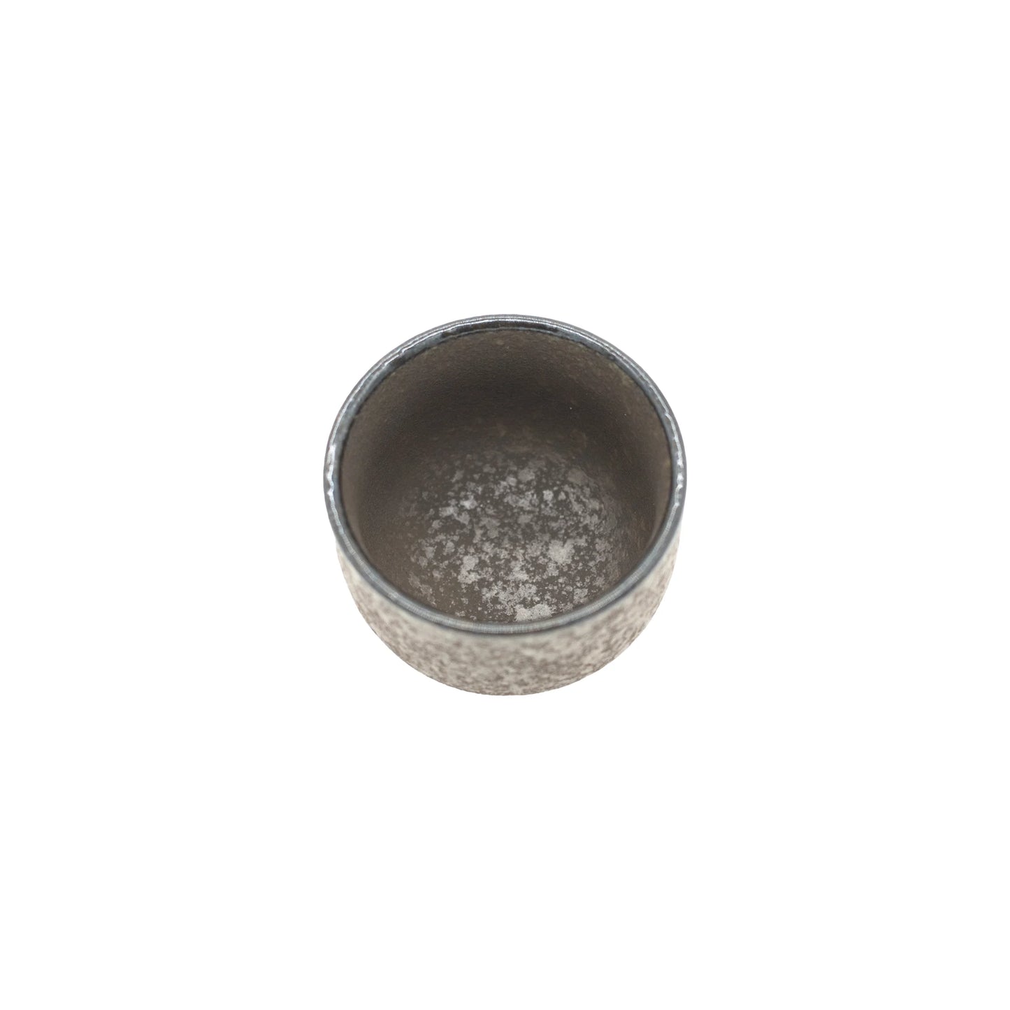
                  
                    A top view of the Sake Cup - Earth reveals its small, round, gray ceramic form with a textured, mottled surface, highlighting Japanese craftsmanship against a plain white background.
                  
                