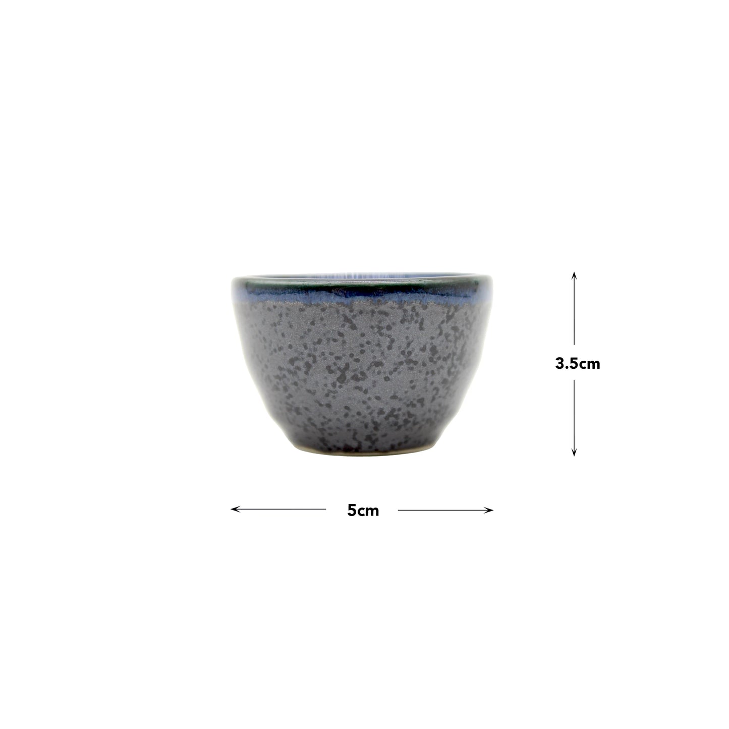 The Sake Cup - Indigo Dipped Edge is a small Minoyaki porcelain bowl with a speckled gray finish and indigo rim, handcrafted by Ichi kiln. At 5 cm wide and 3.5 cm tall, its perfect for sake or serving small treats.