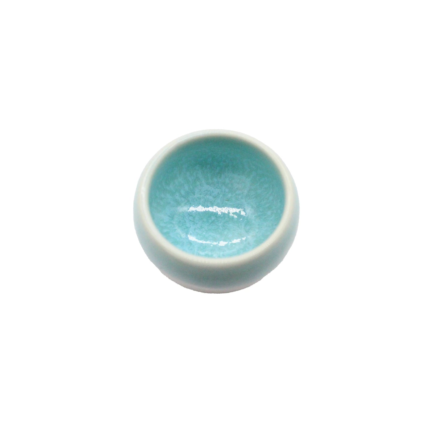 A small, round Minoyaki Seiryuu Sake Cup in light blue with a glossy, slightly crackled interior, shown against a plain white background.