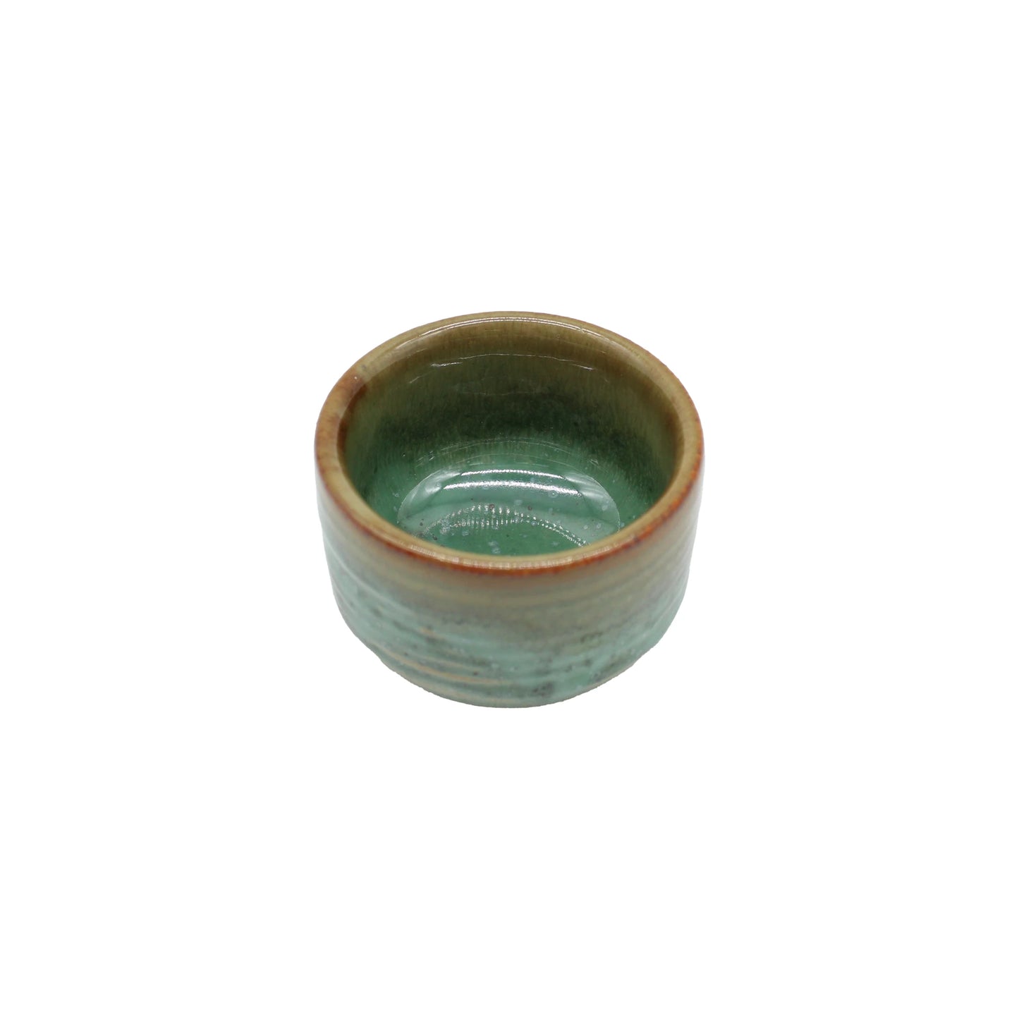 
                  
                    The Sake Cup - Moss Green is a small, round Japanese ceramic bowl with a glossy moss green glaze and a brown rim, displayed on a white background.
                  
                