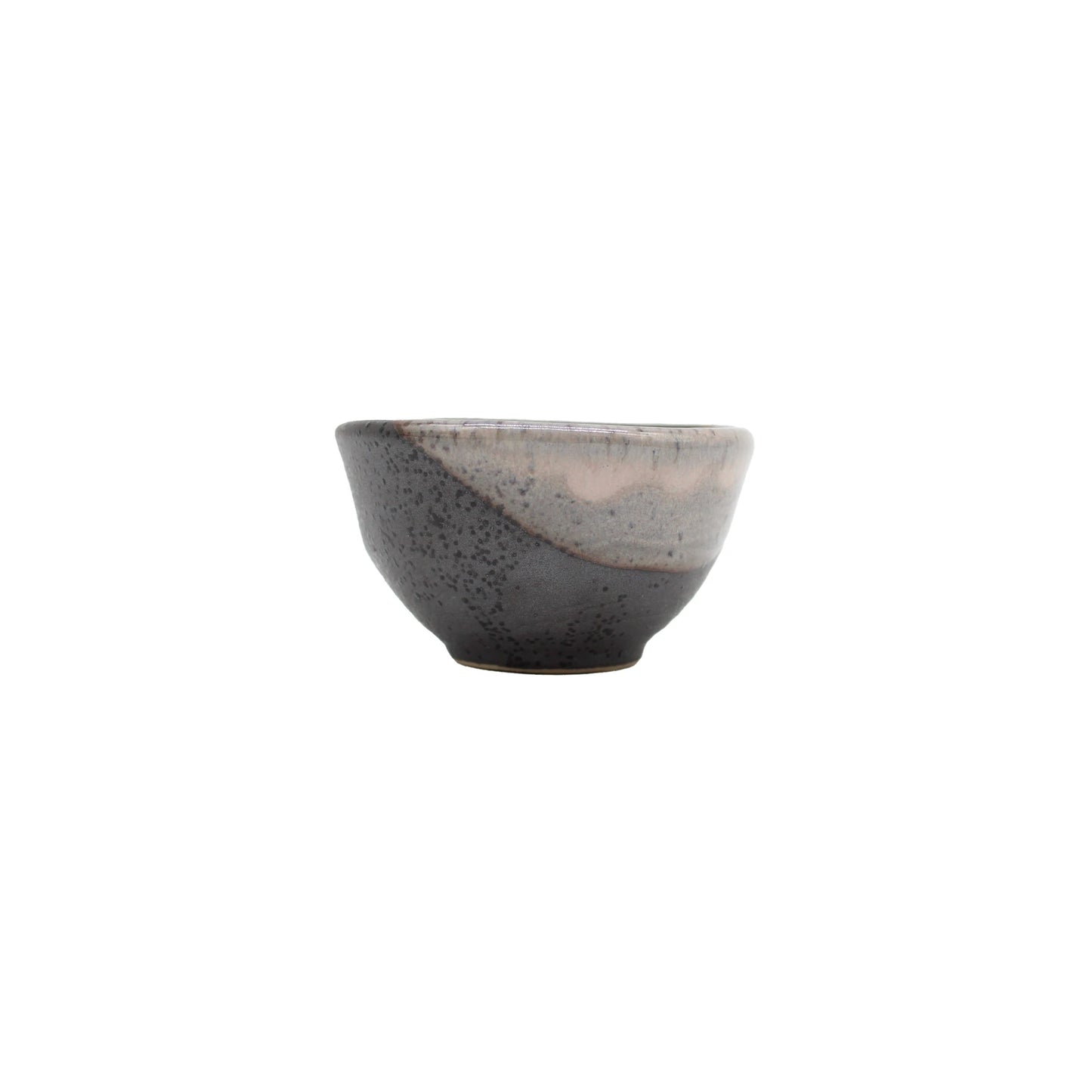 
                  
                    A small handcrafted Sake Cup in black and sakura pink glaze, inspired by traditional Mino pottery, displayed against a plain white background.
                  
                