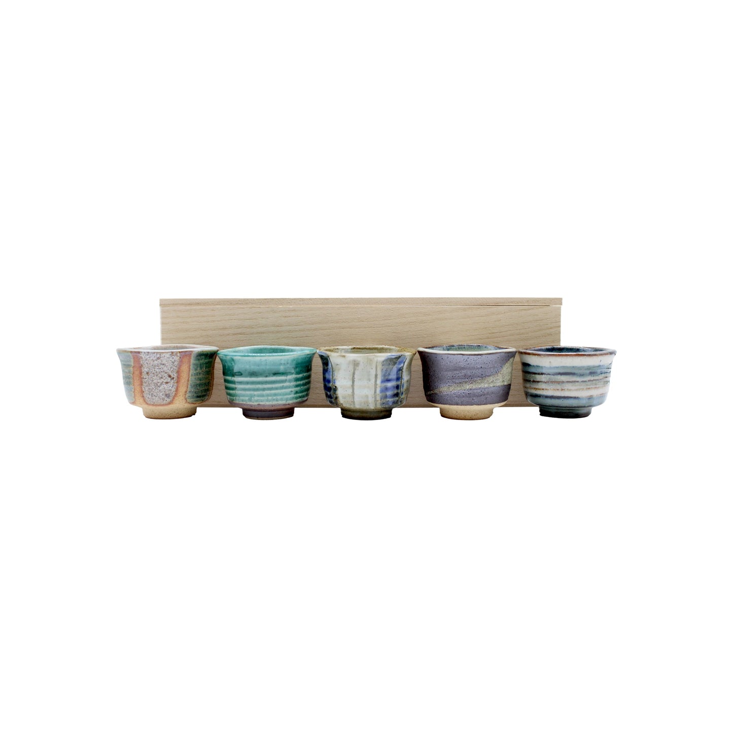 
                  
                    The Ochoko Sake Cups - Set of 5 features five small, multicolored cups arranged before a light wooden box on a white background, reflecting Japanese ceramic tradition.
                  
                