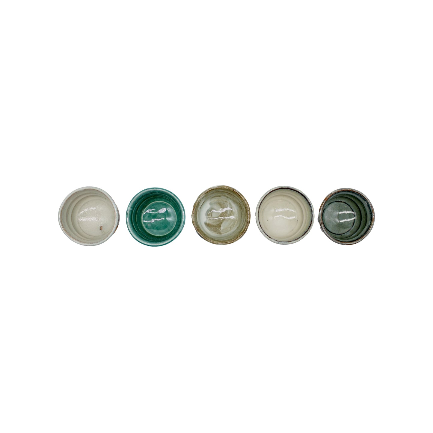 
                  
                    The Ochoko Sake Cups - Set of 5 features small cups in shades of white, green, and brown, arranged in a row on a white background, reflecting the refined elegance of Japanese ceramic tradition.
                  
                