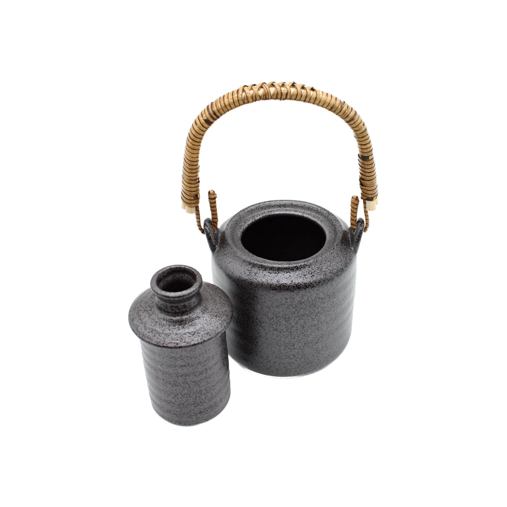 The Sake Heating or Chilling Pot With Ibushi Handle, crafted in black ceramic, sits beside a matching small jar against a white background.
