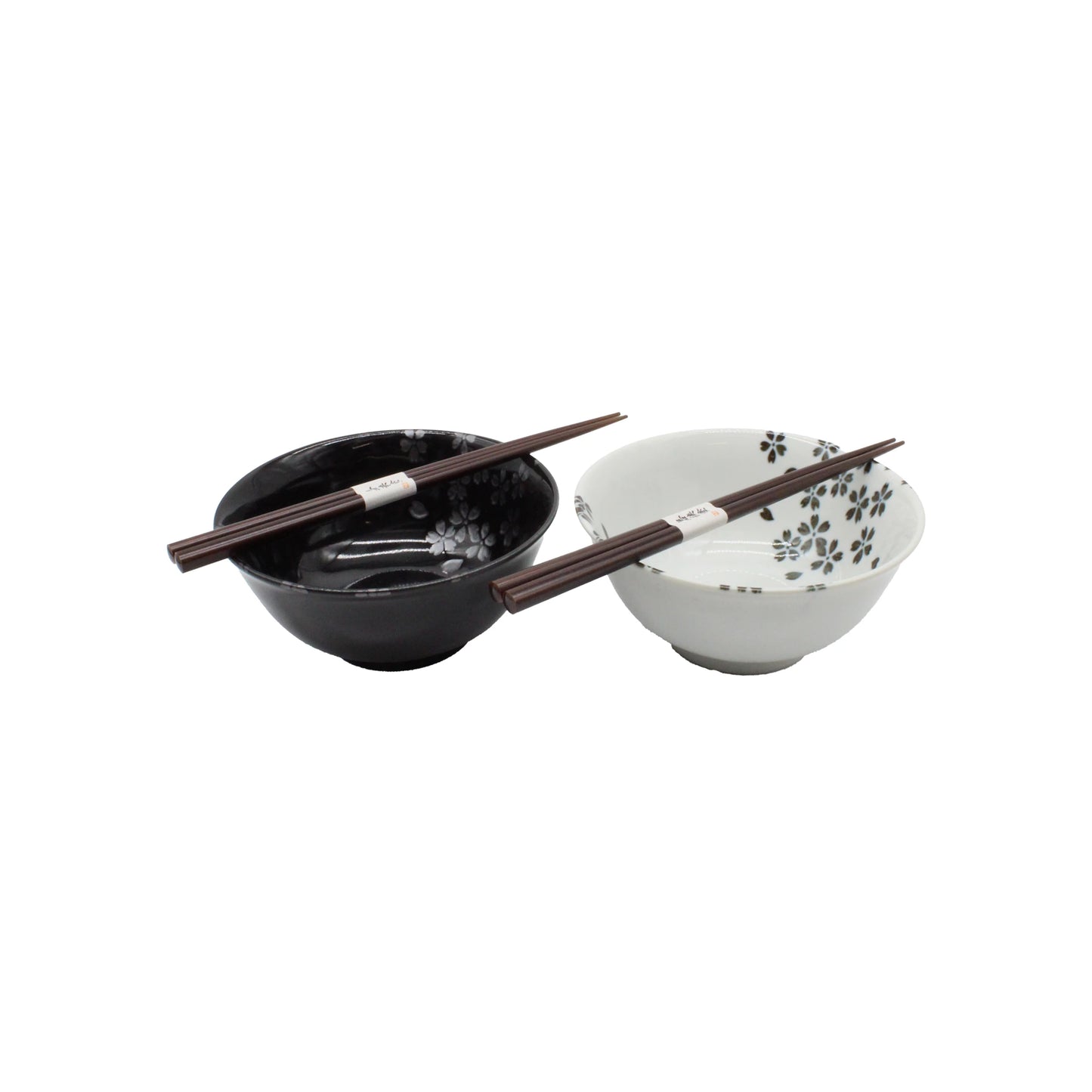 
                  
                    The Sakura Blossom Bowls Gift Set – Black & White includes a black and a white ceramic bowl adorned with sakura motifs, each accompanied by dark chopsticks, beautifully arranged on a white background.
                  
                