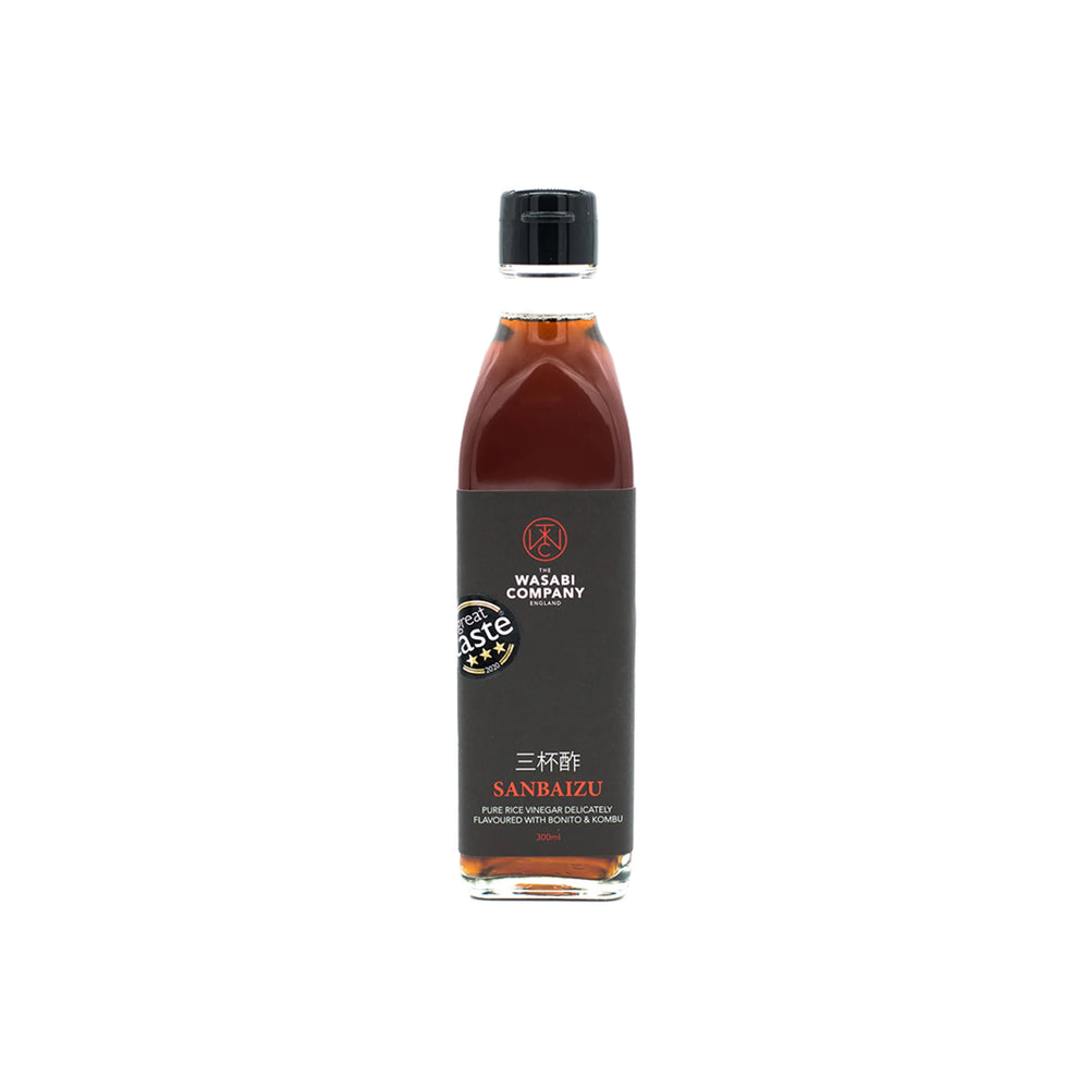 A bottle of Sanbaizu - 300ml, crafted with Marusho vinegars for rich umami flavor, features a black label and black cap set against a white background.