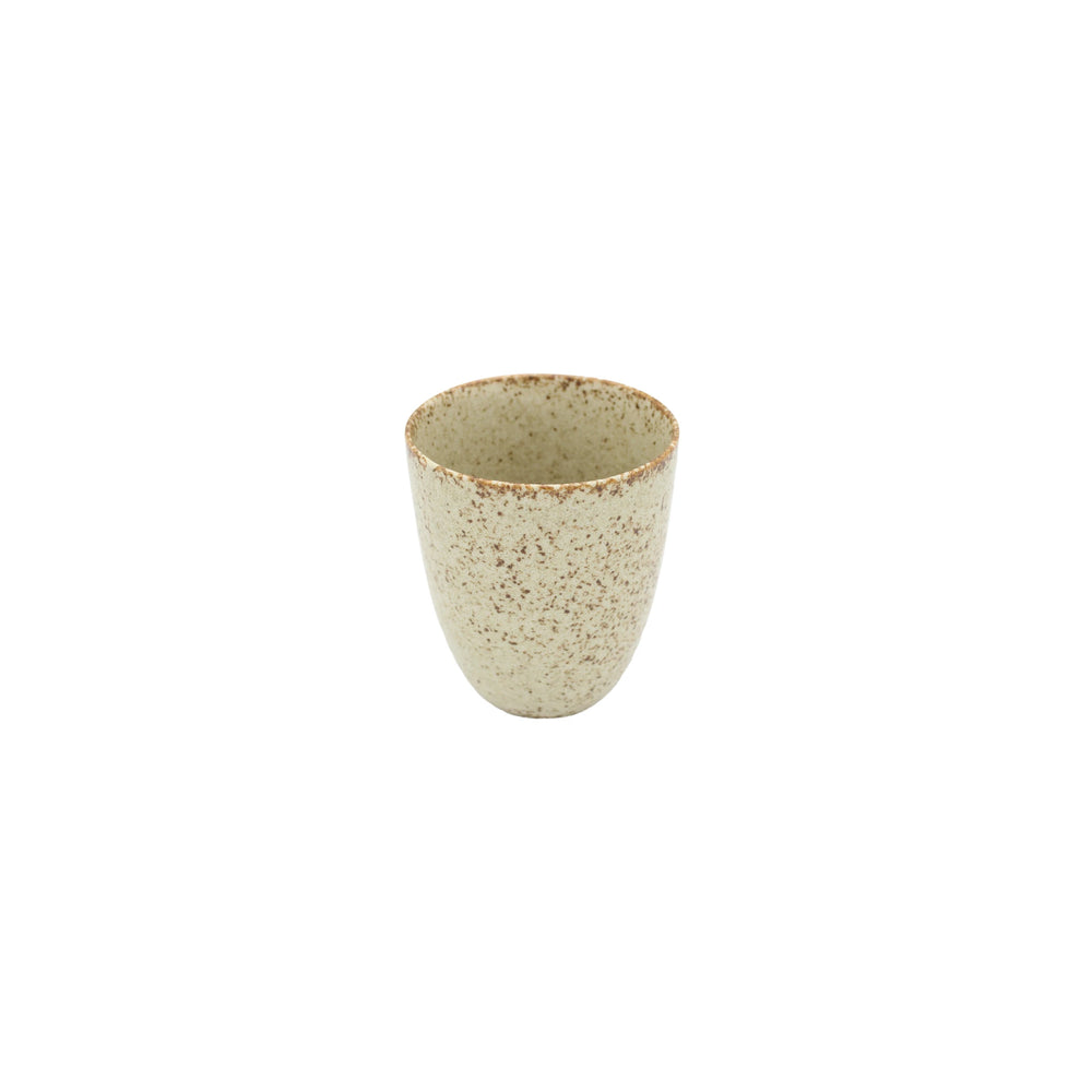 The Tea Mug - Sand Fade is a small, beige handmade Minoyaki porcelain mug with a speckled pattern, displayed on a white background.